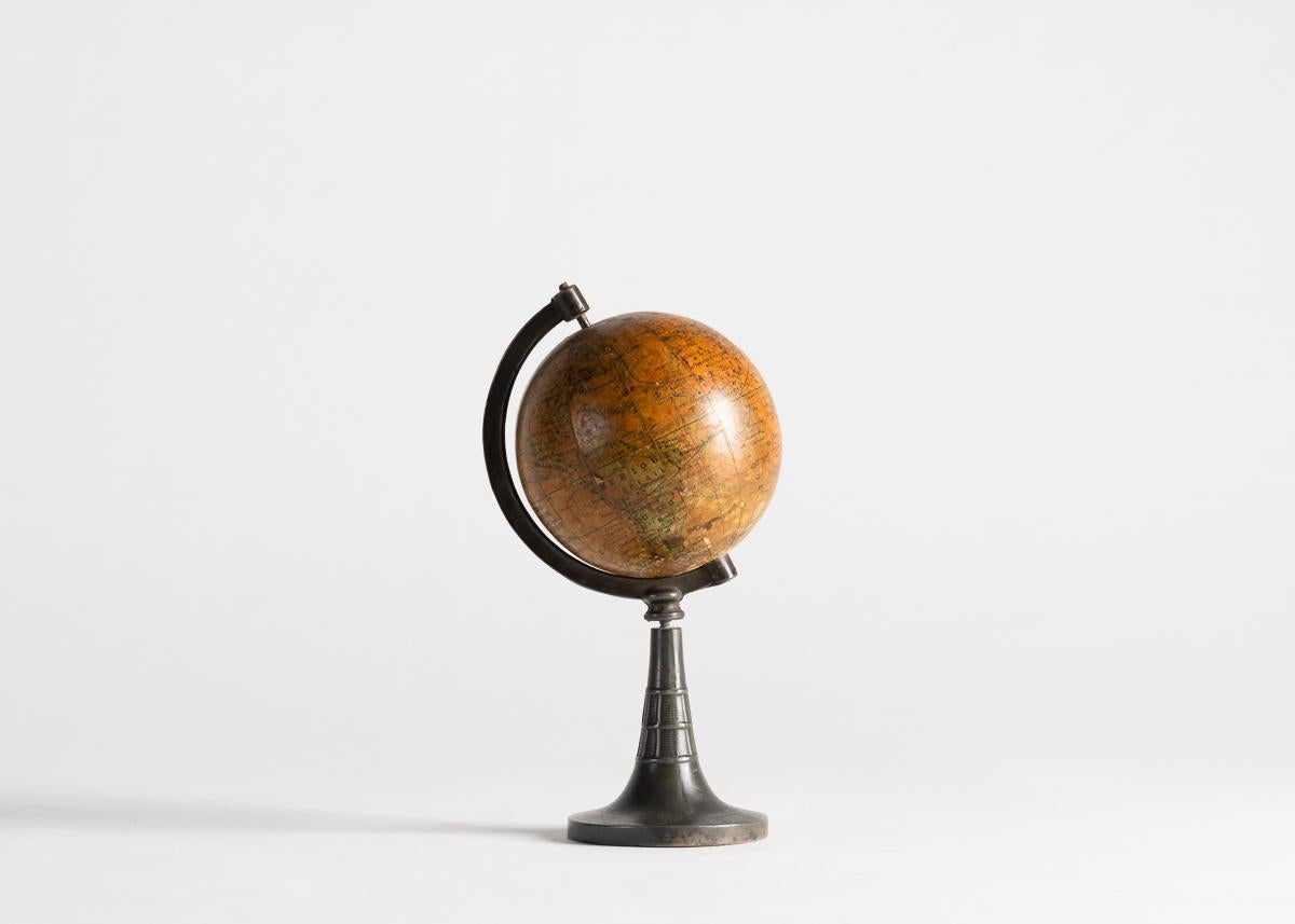 A charming globe on metal base dating from the early 20th century, and executed in France.