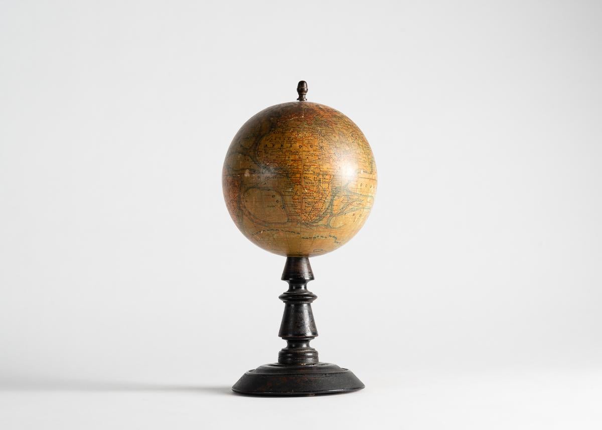 A charming globe on ebonized base dating from the early 20th century, and executed in France.