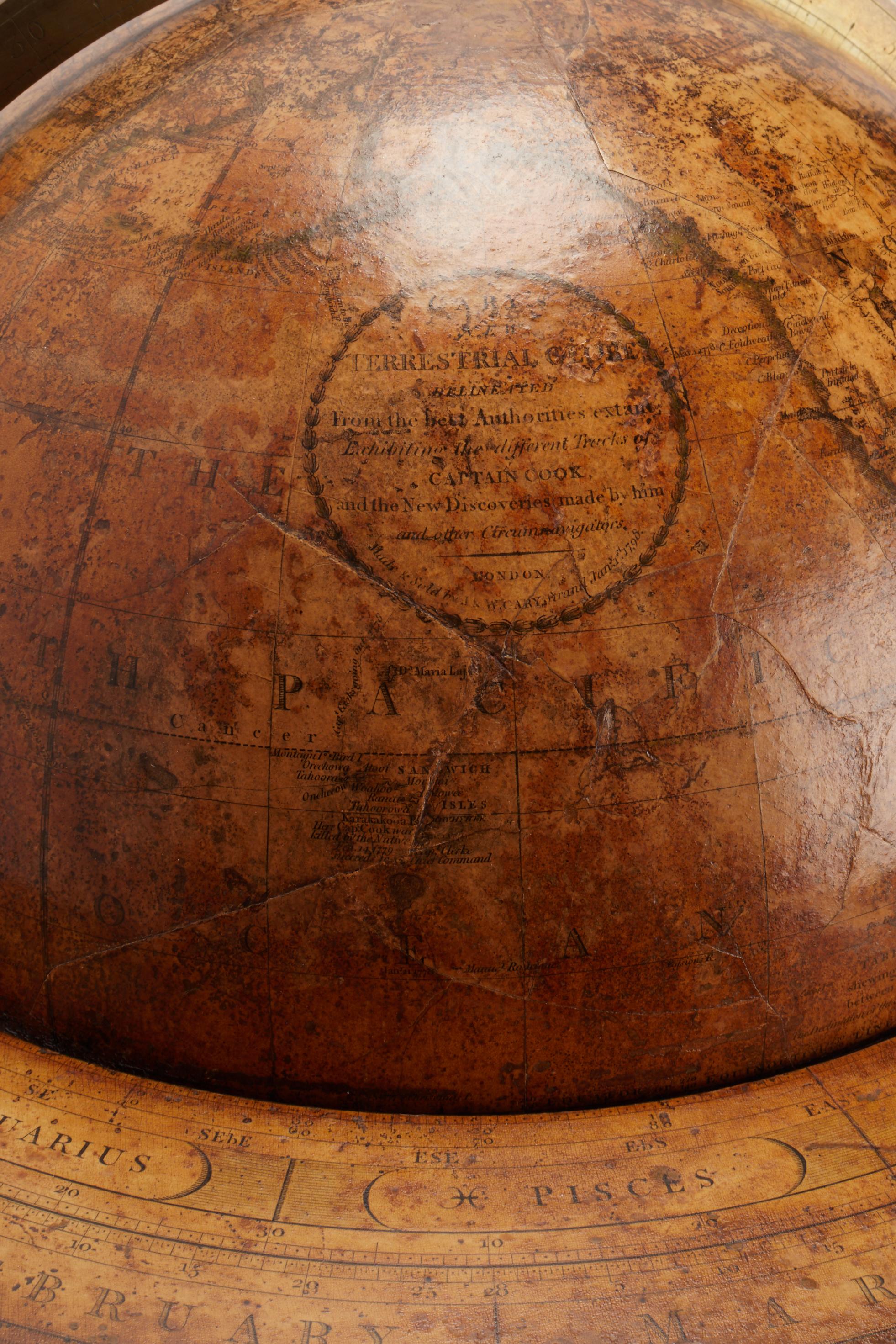 Large 'Papier Machè' terrestrial globe with gores printed in calcography a color finished, on a wooden tripod. One compass joints the three feet. Brass meridian. Maker CARY, London, England, circa 1798.