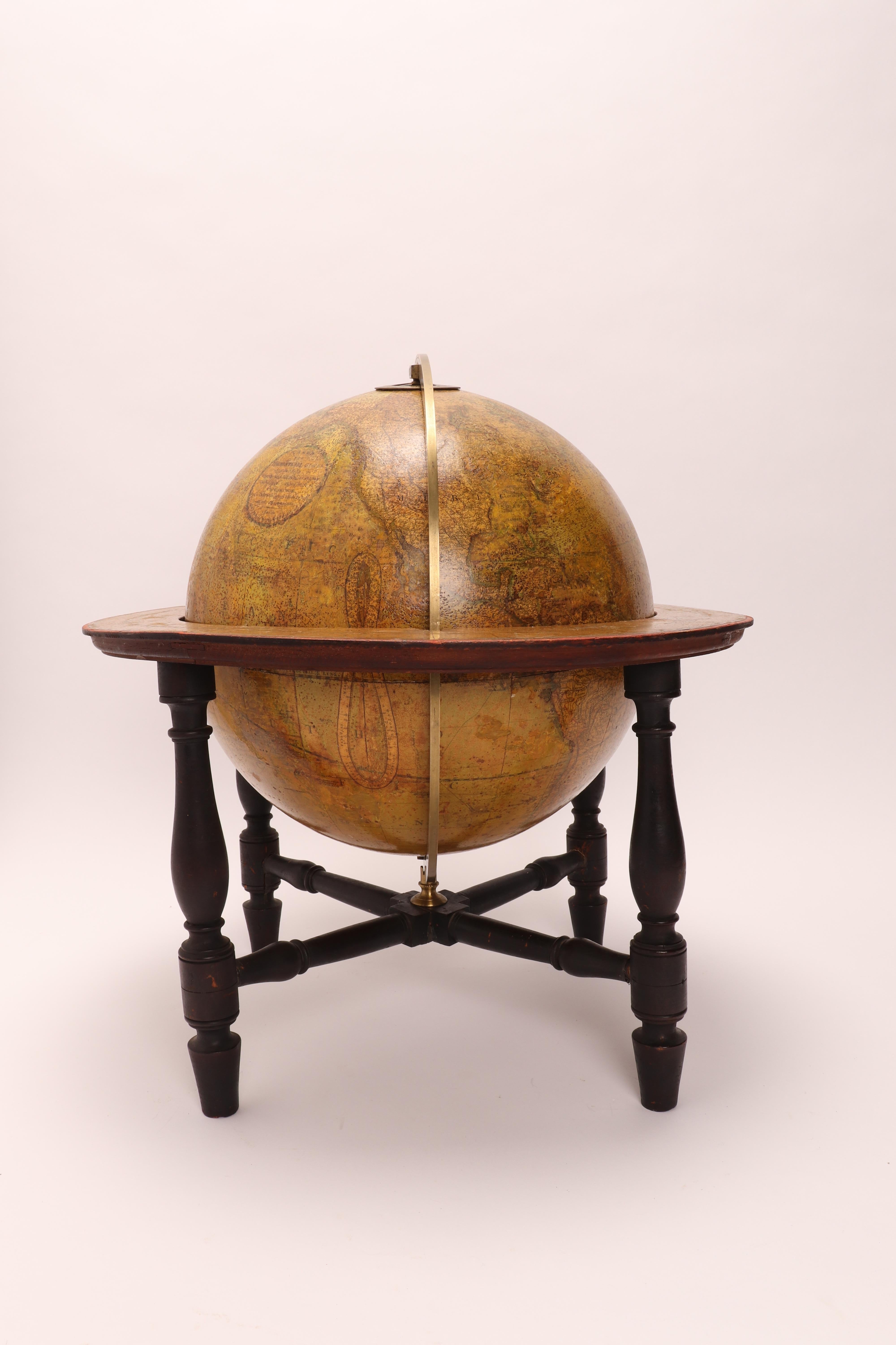 Large 'Papier Machè' terrestrial globe ( 12” diameter ), with gores printed in calcography and color finished, on a wooden base. Maker CARY. London, England, circa 1800.