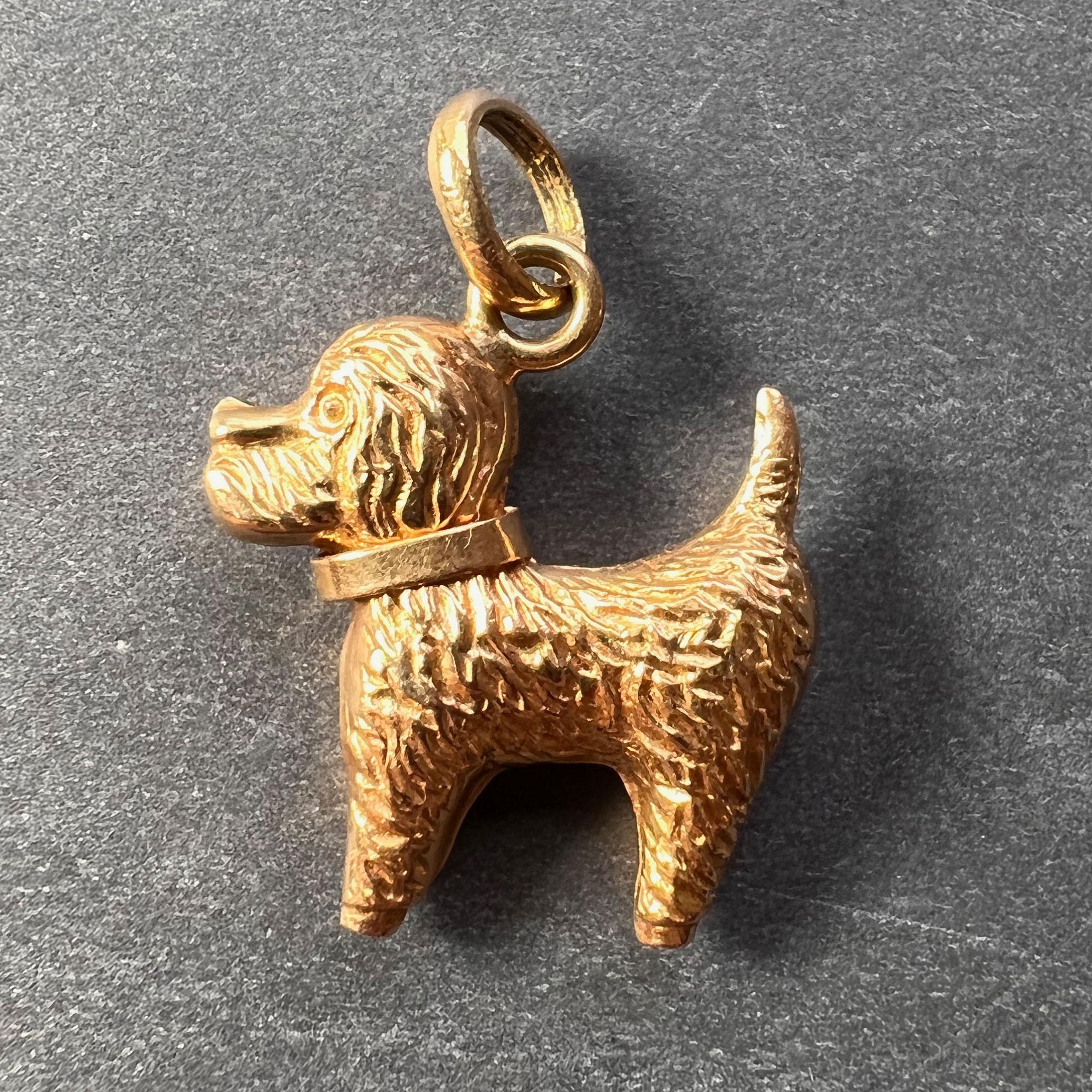 An 18 karat (18K) yellow gold charm pendant designed as a terrier dog. Stamped 750 for 18 karat gold to the bail.
 
Dimensions: 2 x 1.8 x 0.5 cm (not including jump ring)
Weight: 1.96 grams
