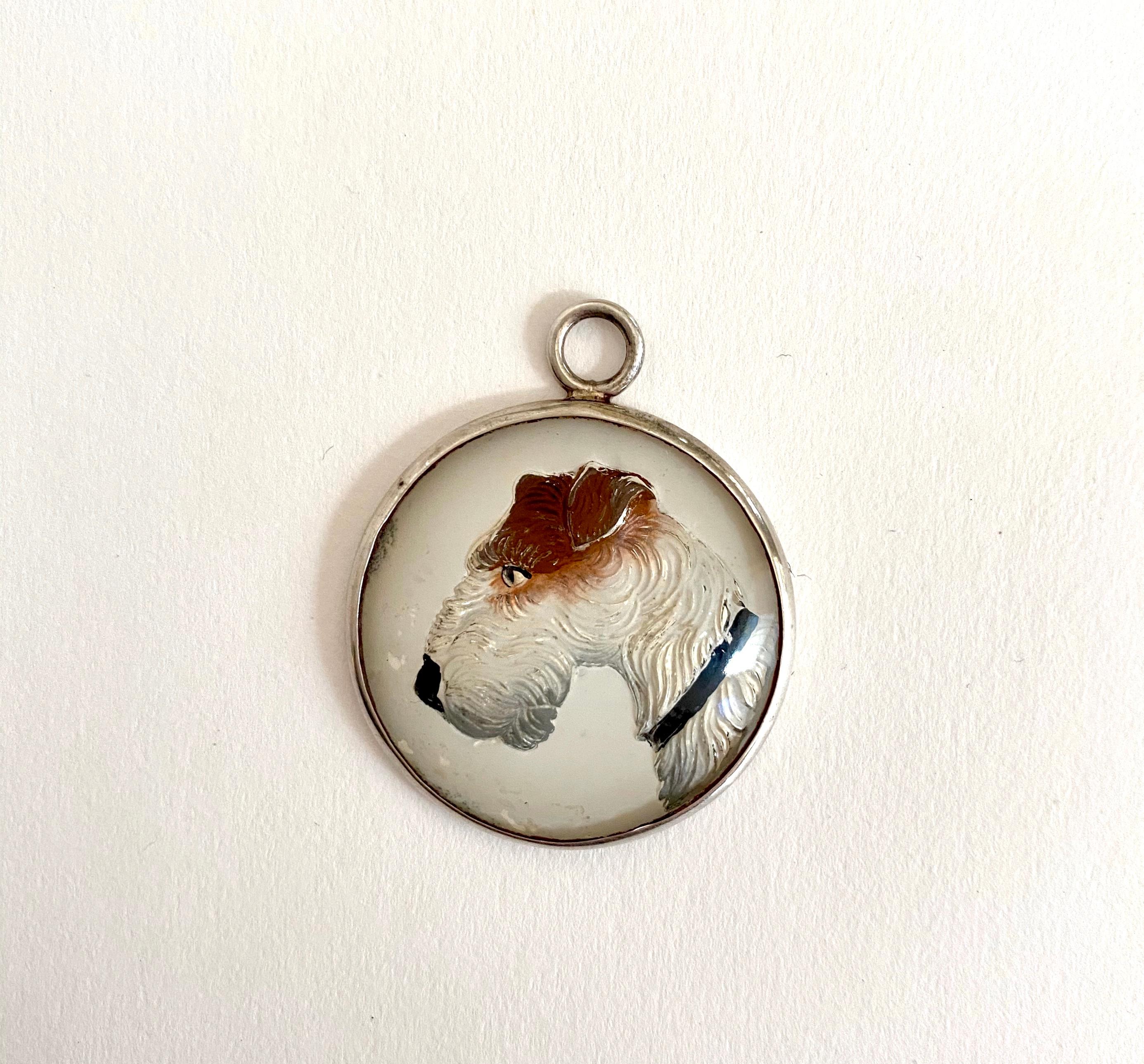Fabulous set of six, reverse crystal intaglios of Fox Terriers, Horses and a Pheasant or as they are often called Essex Crystals.  All marked sterling on the back.  The three horses have a slightly silver background and they are chocolate with a
