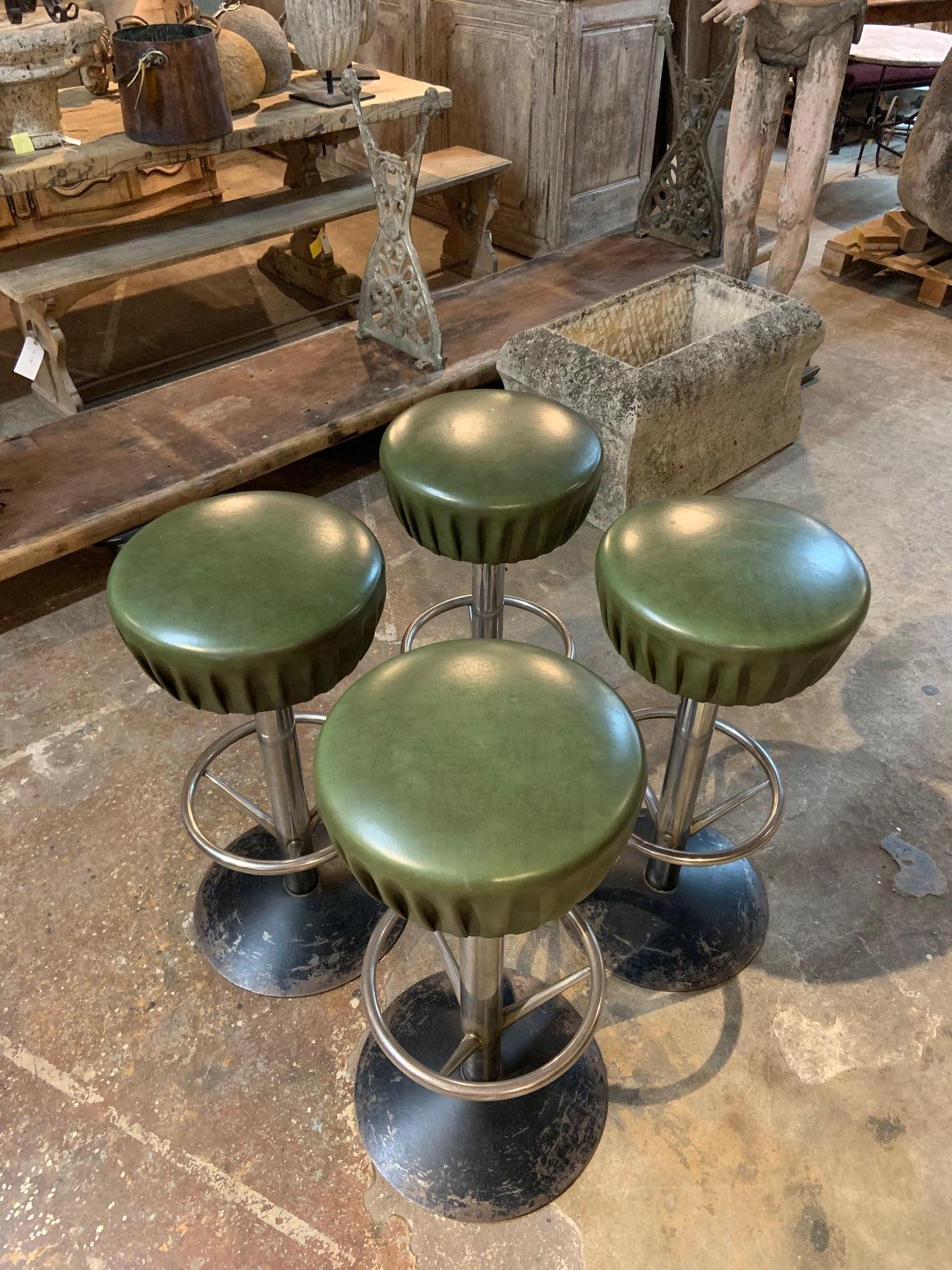 A terrific set of 4 French bar stools from the 1970s. Very stable with vegan leather seats and chromed bases.