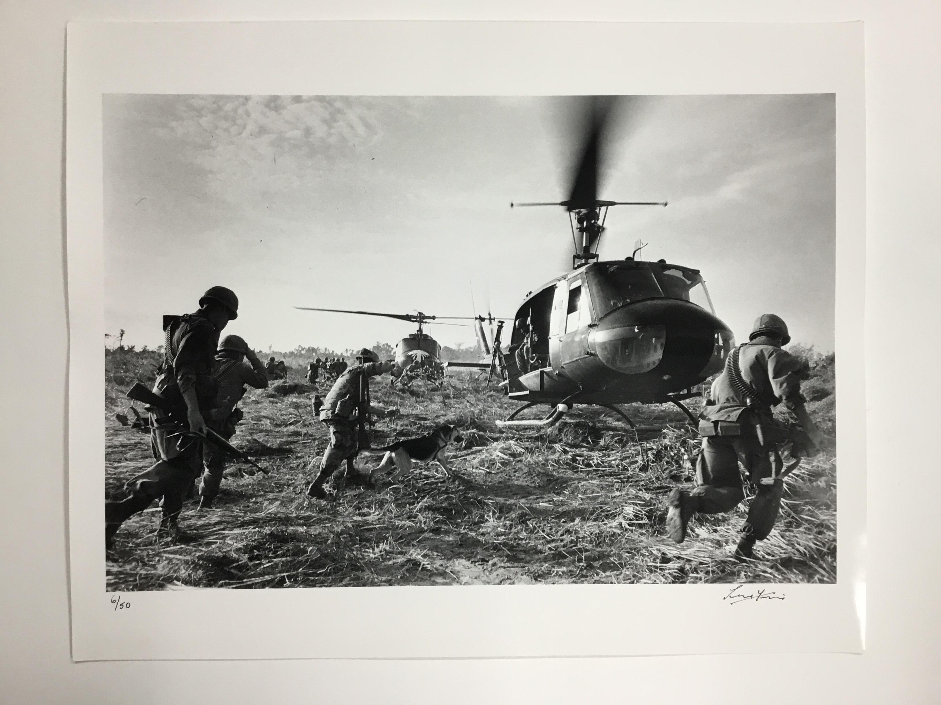 US marines running towards a Bell (UH 1) Huey helicopter and crew in the Tay Ninh area of Vietnam. November 4, 1968 (Photo by Terry Fincher/Getty Images)

DETAILS
- Rare signed print, signature on front.
- Hand printed silver gelatin fibre