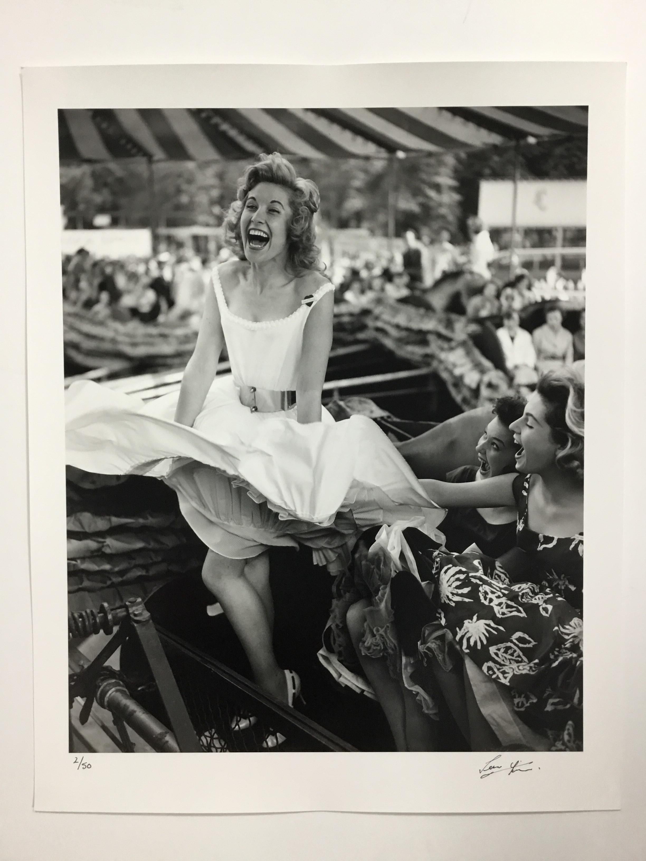 Sherree Danton, Pat Lawrence and Wendy Graham enjoying the wind machine at the opening of the Festival Gardens fun fair, Battersea Park, London. June 1, 1957 (Photo by Terry Fincher/Keystone/Getty Images)

DETAILS
- Rare signed print, signature on