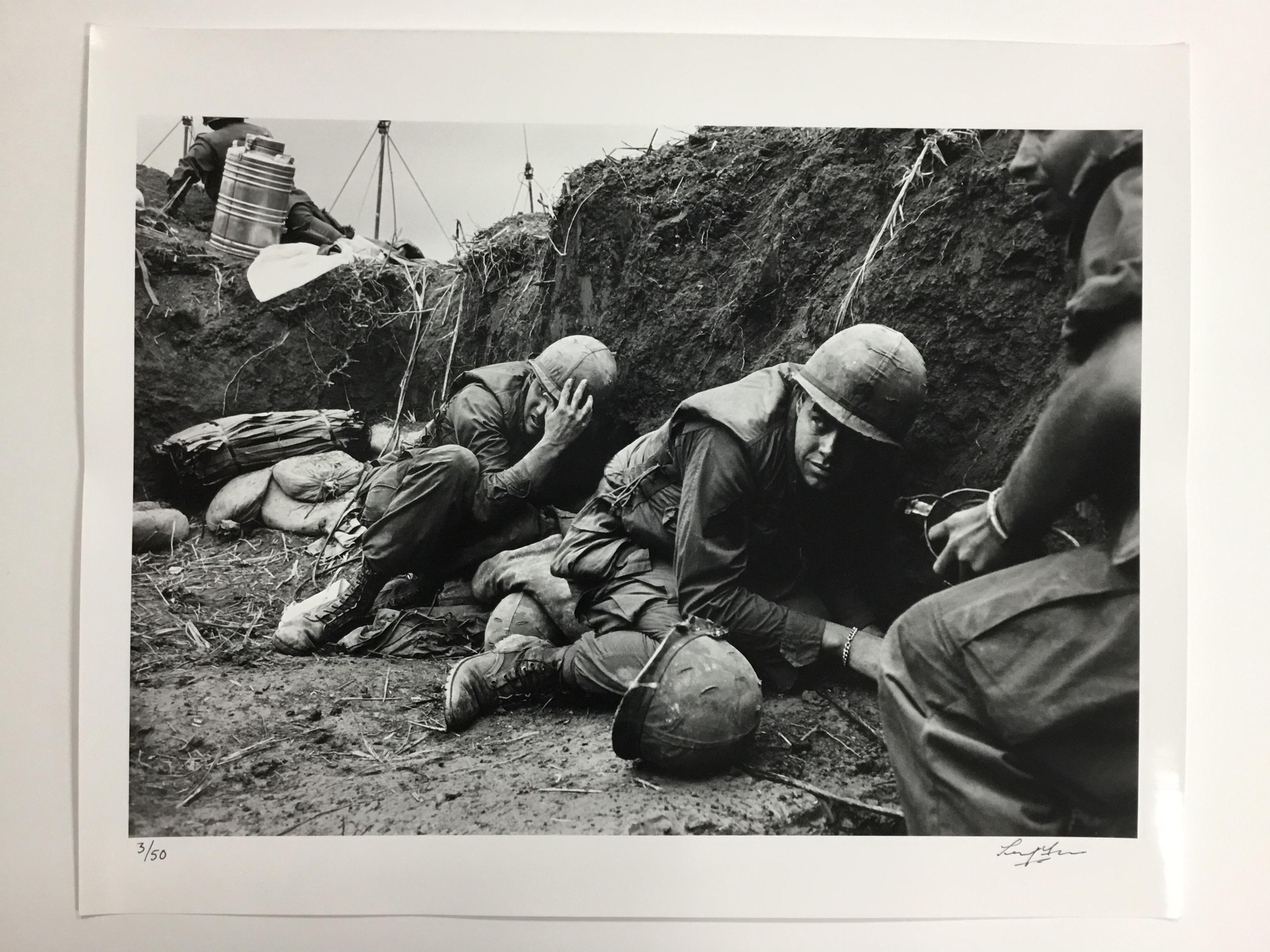 US troops take cover from the Vietcong in a trench on Hill Timothy, during the Vietnam War. April 11, 1968 (Photo by Terry Fincher/Getty Images)

DETAILS
- Rare signed print, signature on front.
- Hand printed silver gelatin fibre photograph. 
-