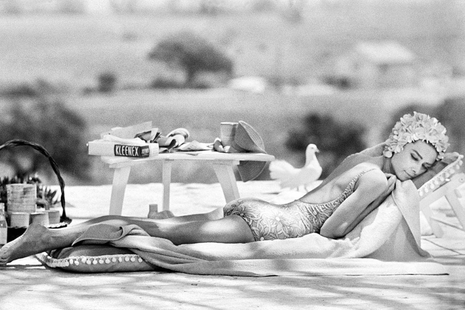 Terry O'Neill Black and White Photograph - Audrey Hepburn Relaxing by a Pool, 1966 