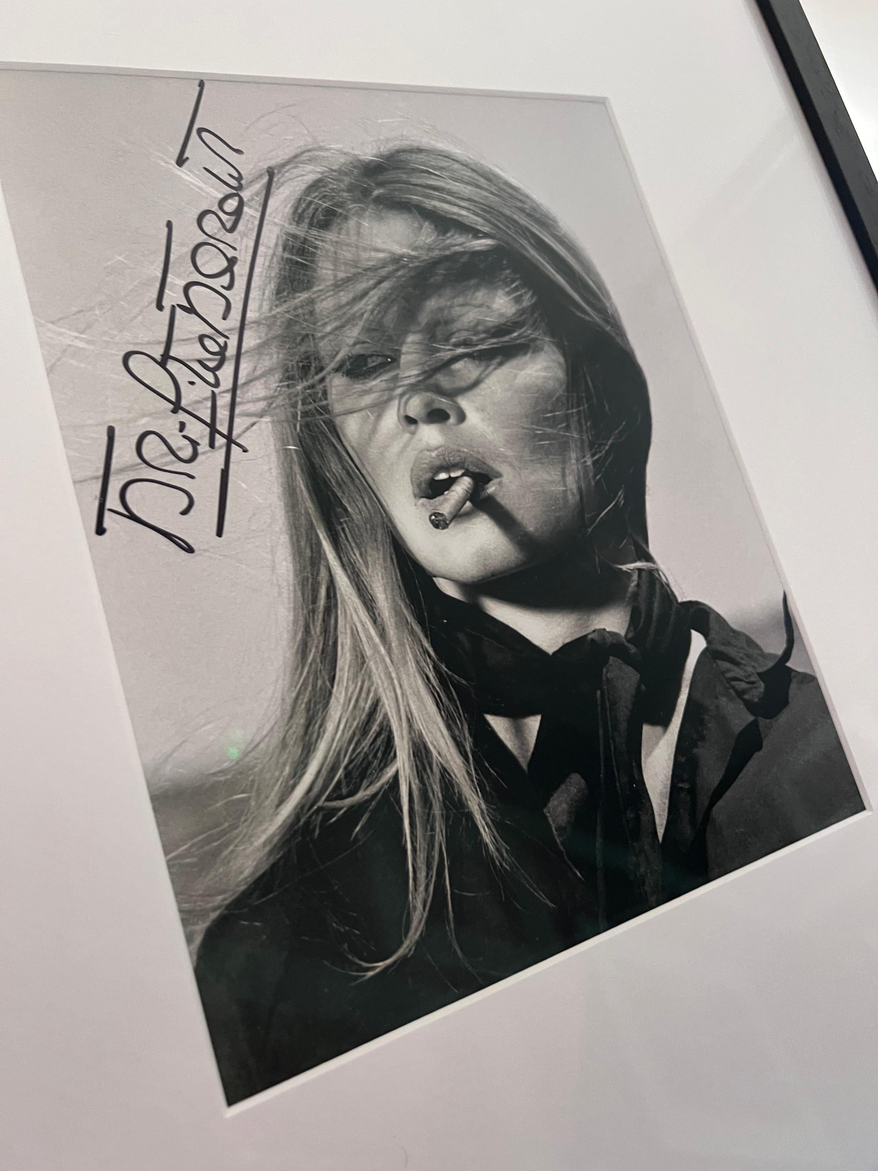 Brigitte Bardot With Cigar In Mexico - hand signed by Brigitte Bardot framed  - Photograph by Terry O'Neill
