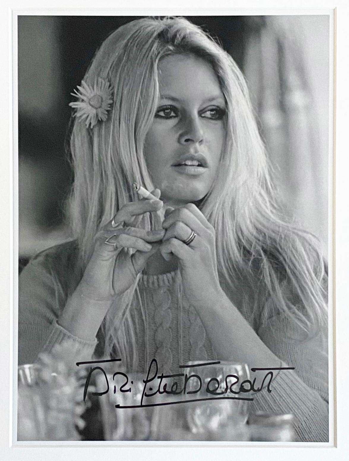 Brigitte Bardot With Flower - hand signed by Brigitte Bardot framed  - Photograph by Terry O'Neill