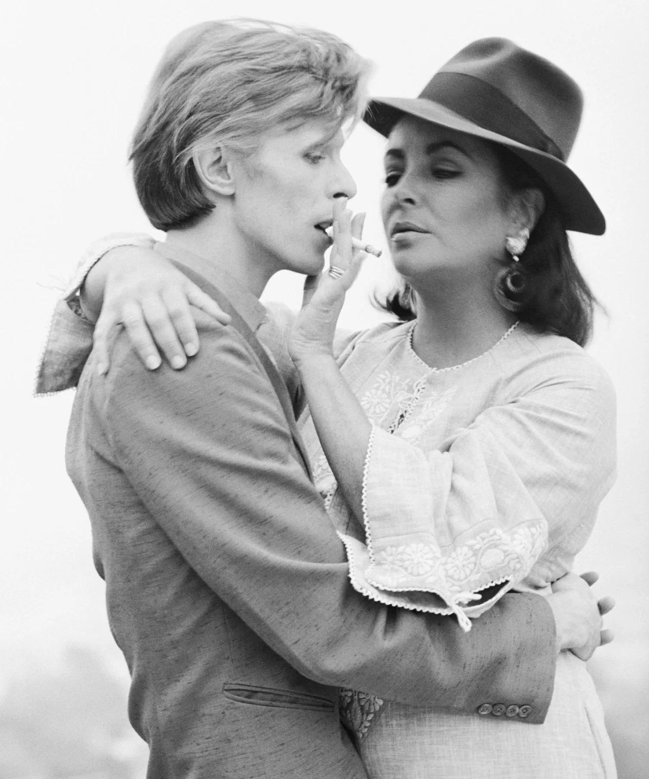 Terry O'Neill Portrait Photograph - David Bowie and Elizabeth Taylor, Beverly Hills
