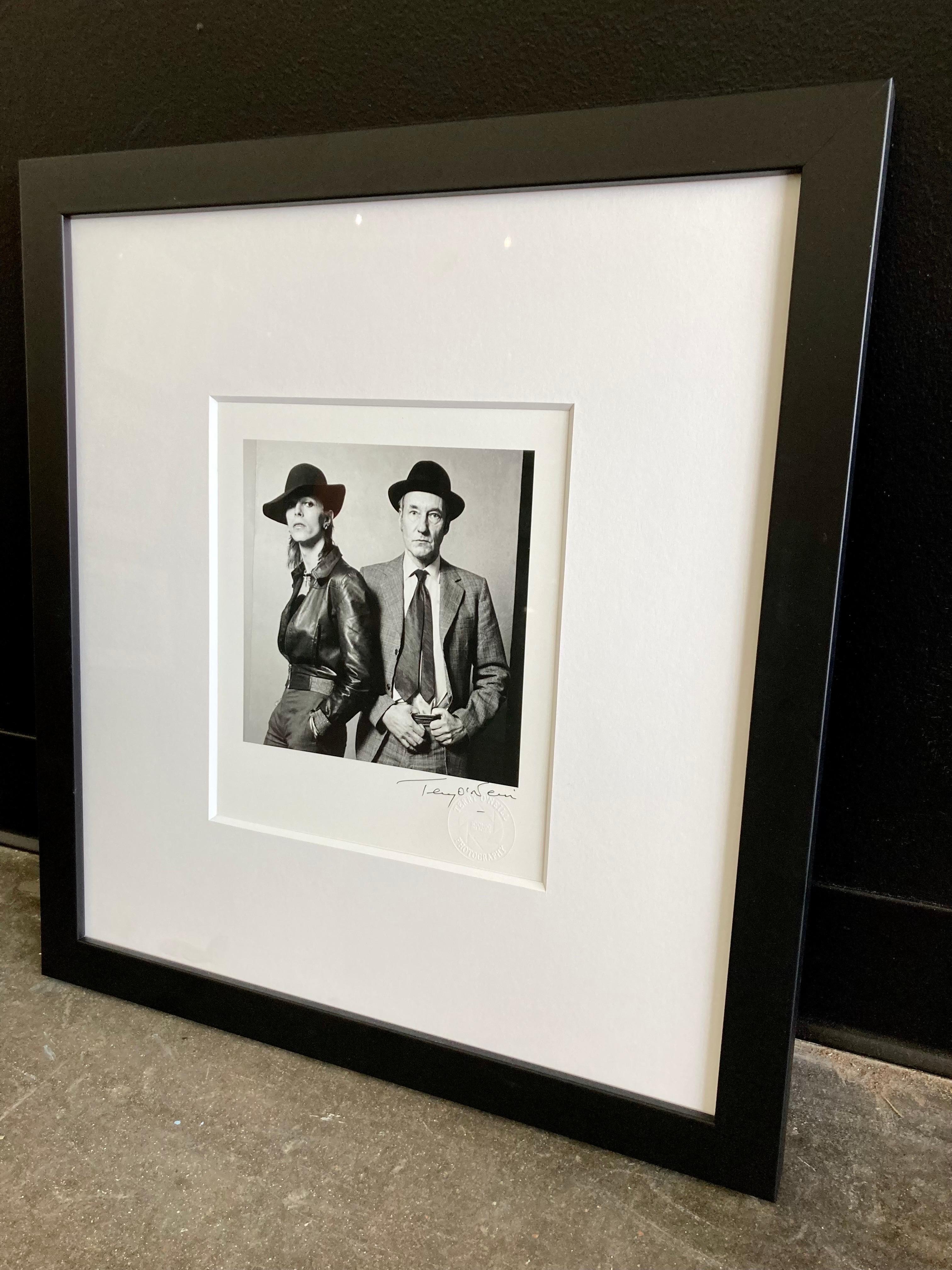 Ready to ship immediately. Free domestic US shipping.

David Bowie and William Burroughs in Los Angeles, February 1974, signed Terry O'Neill, 8x10" print, custom framed with non-glare museum glass, 8ply matting and a simple black frame.

This print