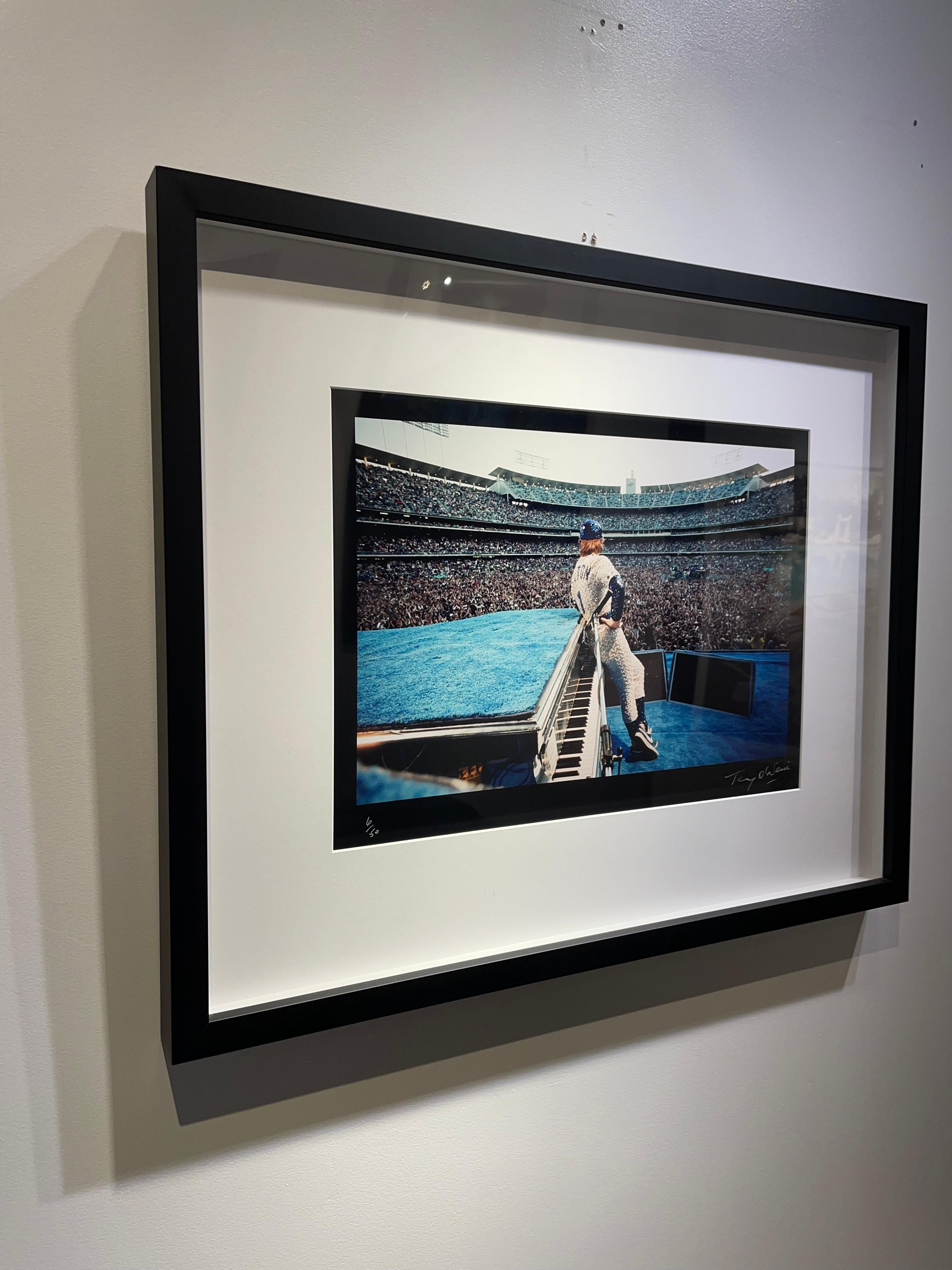 Elton John At Dodger Stadium, Back View, Custom Framed  - Contemporary Photograph by Terry O'Neill