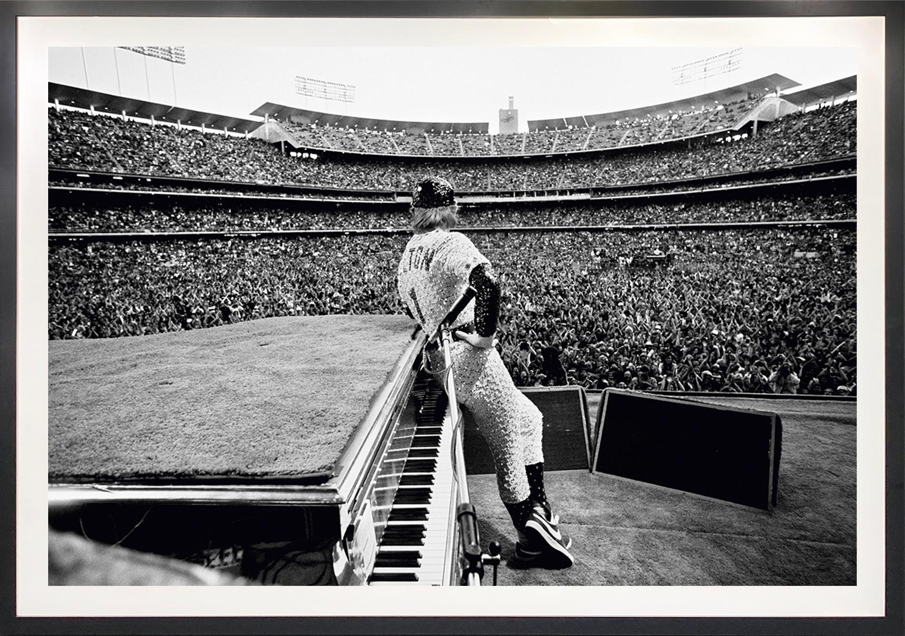 Elton John, Dodger Stadium - Black Still-Life Photograph by Terry O'Neill