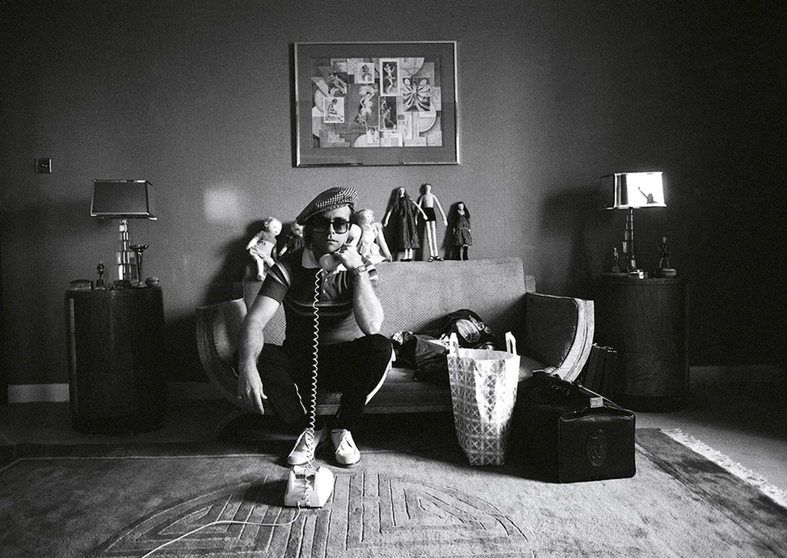 Terry O'Neill Portrait Photograph - Elton John with Telephone