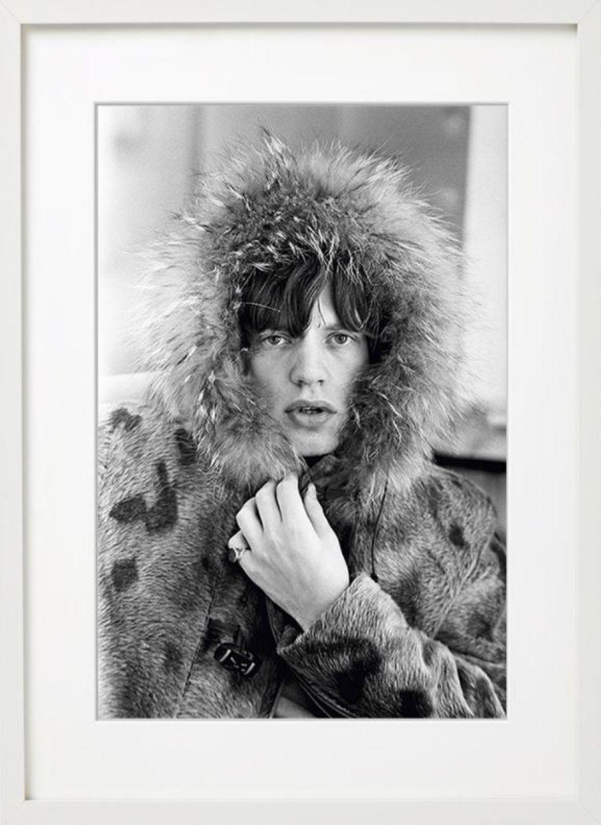 Mick Jagger - the rockstar in the snow in a fur coat - Photograph by Terry O'Neill