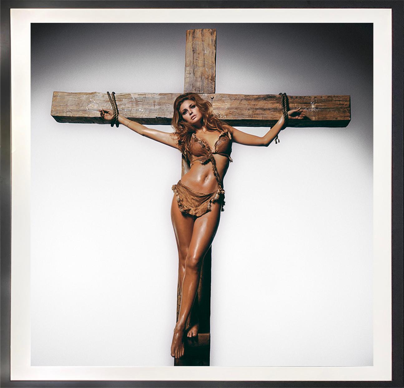 Raquel Welch on the Cross - Photograph by Terry O'Neill