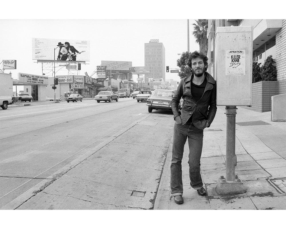 This photo captures a 25-year-old Bruce Springsteen just after his visit to Tower Records. Springsteen was in LA promoting his new album, Born to Run, 1975. The album was Springsteen's first top 10 album and would cement him as a veritable rock and