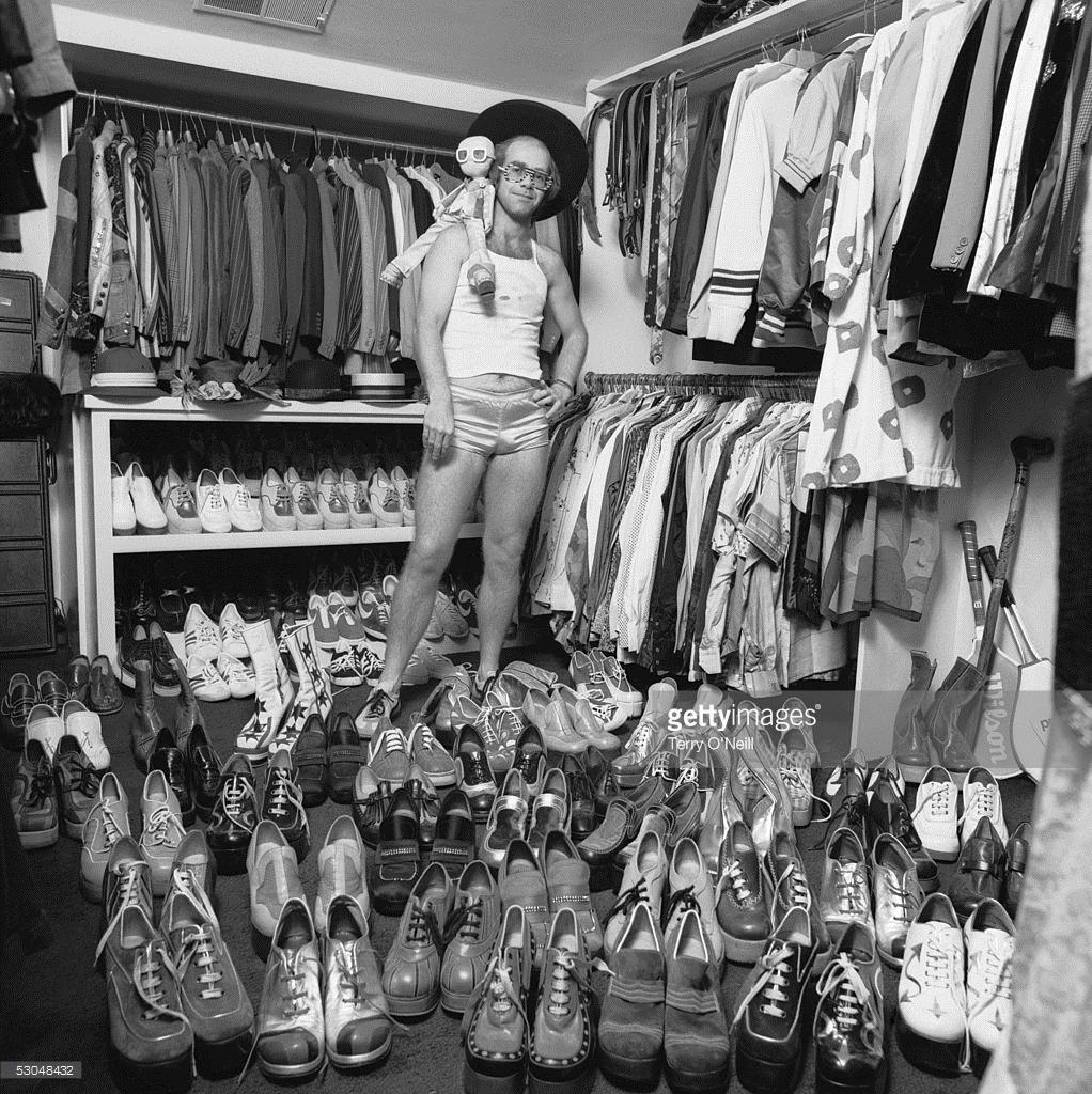 Elton John at Home, 1972
Silver Gelatin Print
40 x 40 inches
Estate signature stamped and numbered Edition of 50
with certificate of authenticity

English pop singer Elton John, wearing a vest top and satin shorts, at home in London, 1975, with part