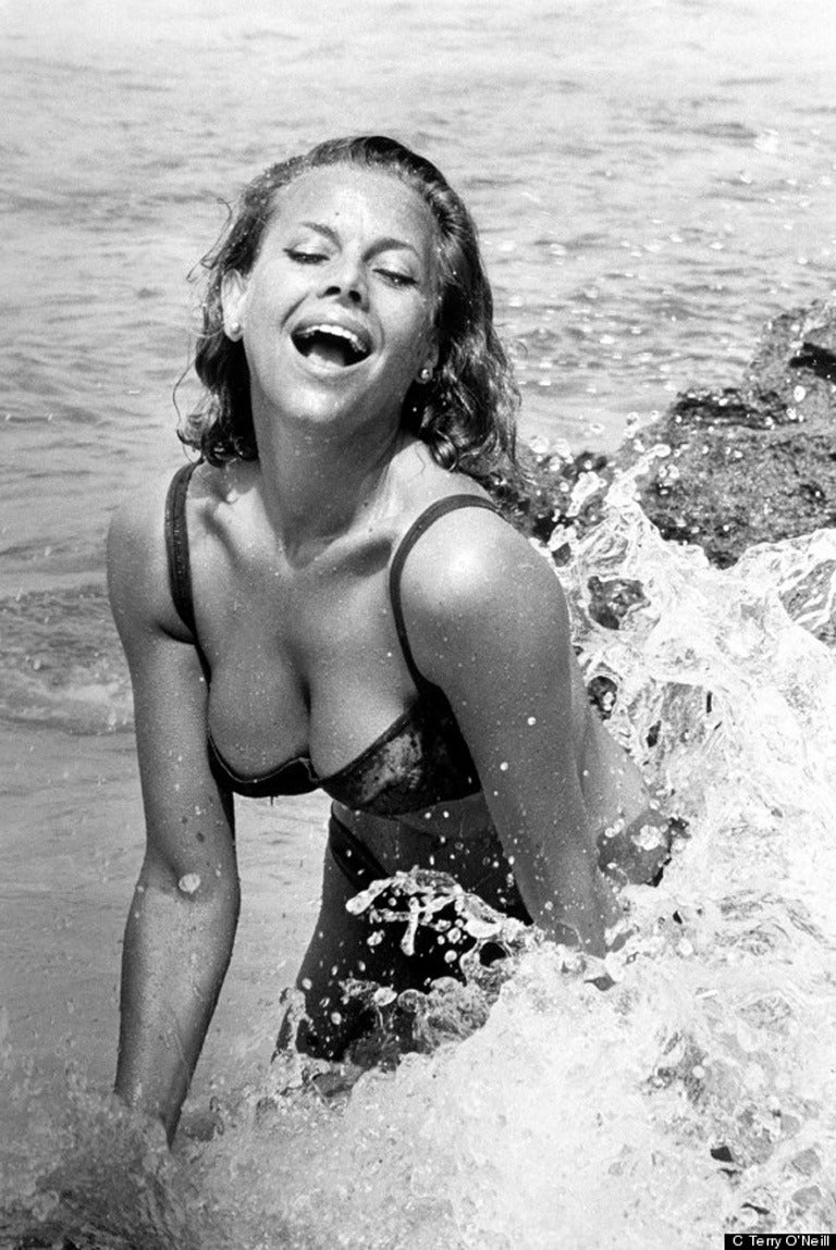 Honor Blackman (Pussy Galore), 1964
Silver gelatin print
Signed and numbered edition of 50

English actress Honor Blackman on a beach, circa 1964. Splashes on the surf, in Miami during the filming as Pussy Galore, from the James Bond thriller,
