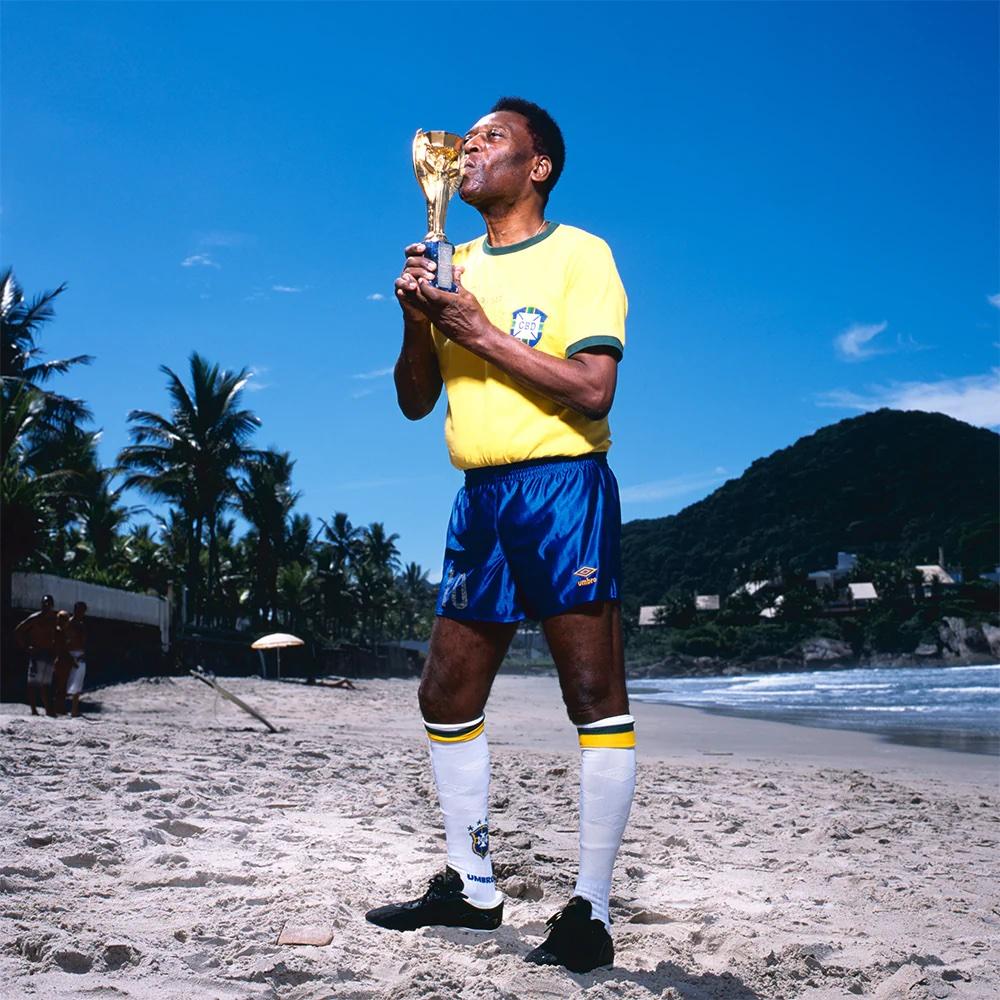 Football legend Pele kisses the World Cup Trophy on the beach near his home in Santos, Brazil in April of 2013. It was this opportunity to photograph Pelé that brought O'Neill briefly out of retirement.

All available sizes & editions:
16" x 20"