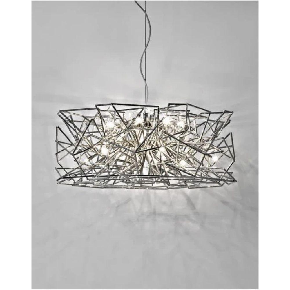 Designed By Christian Lava 

A celestial suspension of interwoven nickel-plated metal shafts, Etoile twinkles in all directions creating a gentle play of light and shadow for any space. 

Material: Nickel

Pendant Height: Ø 27.6” x H