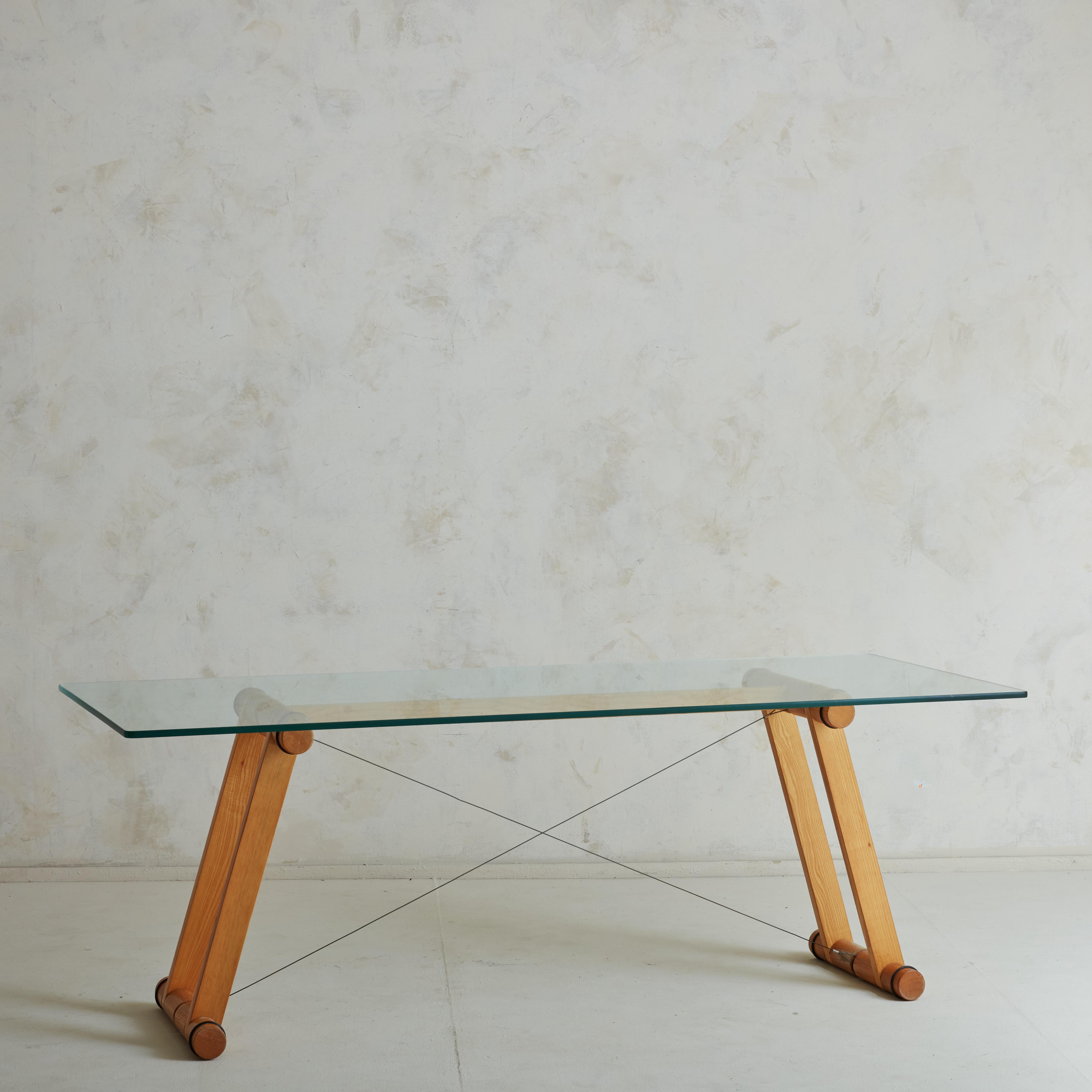 An exceptional 1970s ‘Teso’ table designed by Italian architecture and design group Superstudio  for Giovanetti. This table has a trestle base in beautifully grained ash wood with a crossed steel-wire. The base supports a .5” thick rectangular