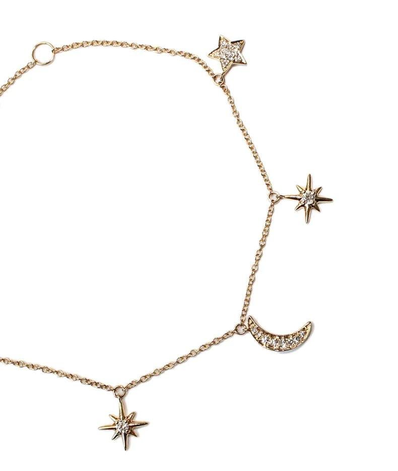 Discover the Gold Charm Bracelet with Diamonds, a symbol of fate's intricate design and the cosmos' endless wonder. This gold charm bracelet, inspired by the 