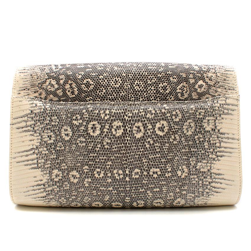 Tess Van Ghert - Cream and Grey Leather Clutch

- envelope flap 
- snap button closure
- metal embellished chain trim
- suede lining
- open interior with zip slip pocket
- exterior slip pocket on the back
- chain not included 

- lizard leather 
-