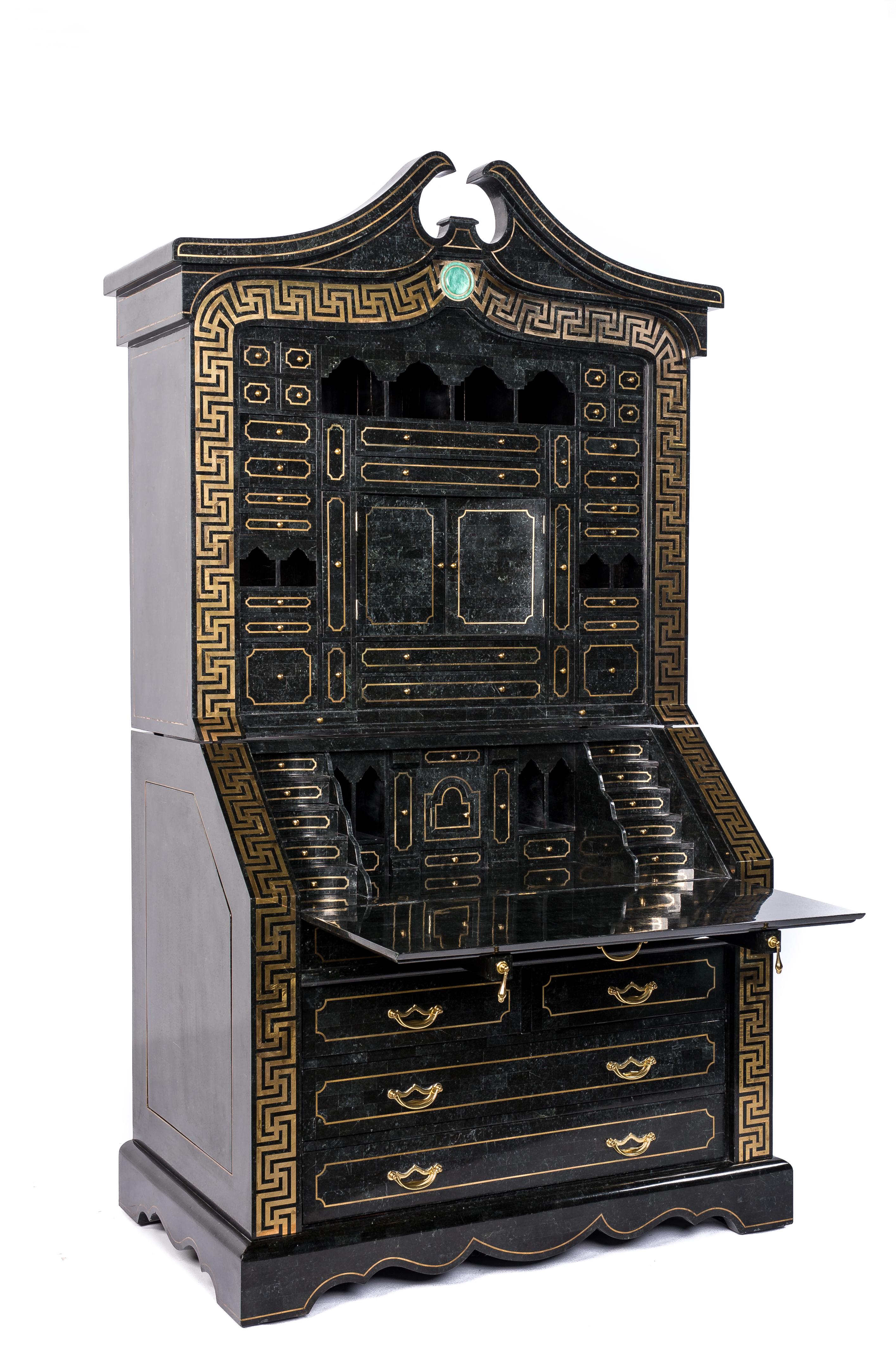 A monumental secretaire made by Maitland-Smith in the late 20th century. The whole piece was decorated with tessellated black marble and solid brass inlaid Greek key pattern. The lower cabinet features 4 drawers with solid brass drawer pulls. The