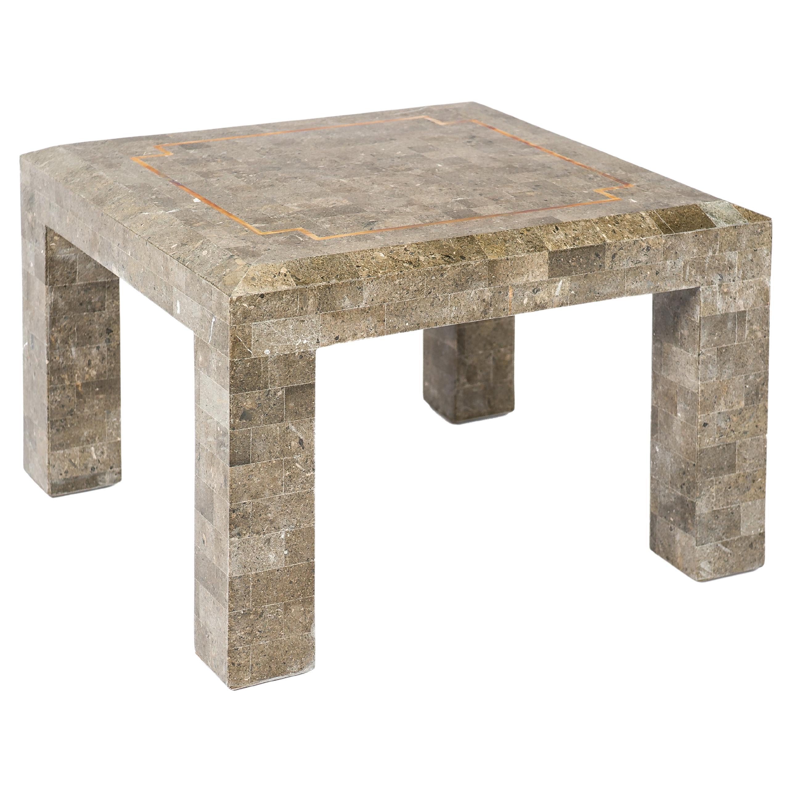 Tesselated fossil stone and inlaid brass coffee table by Maitland Smith For Sale