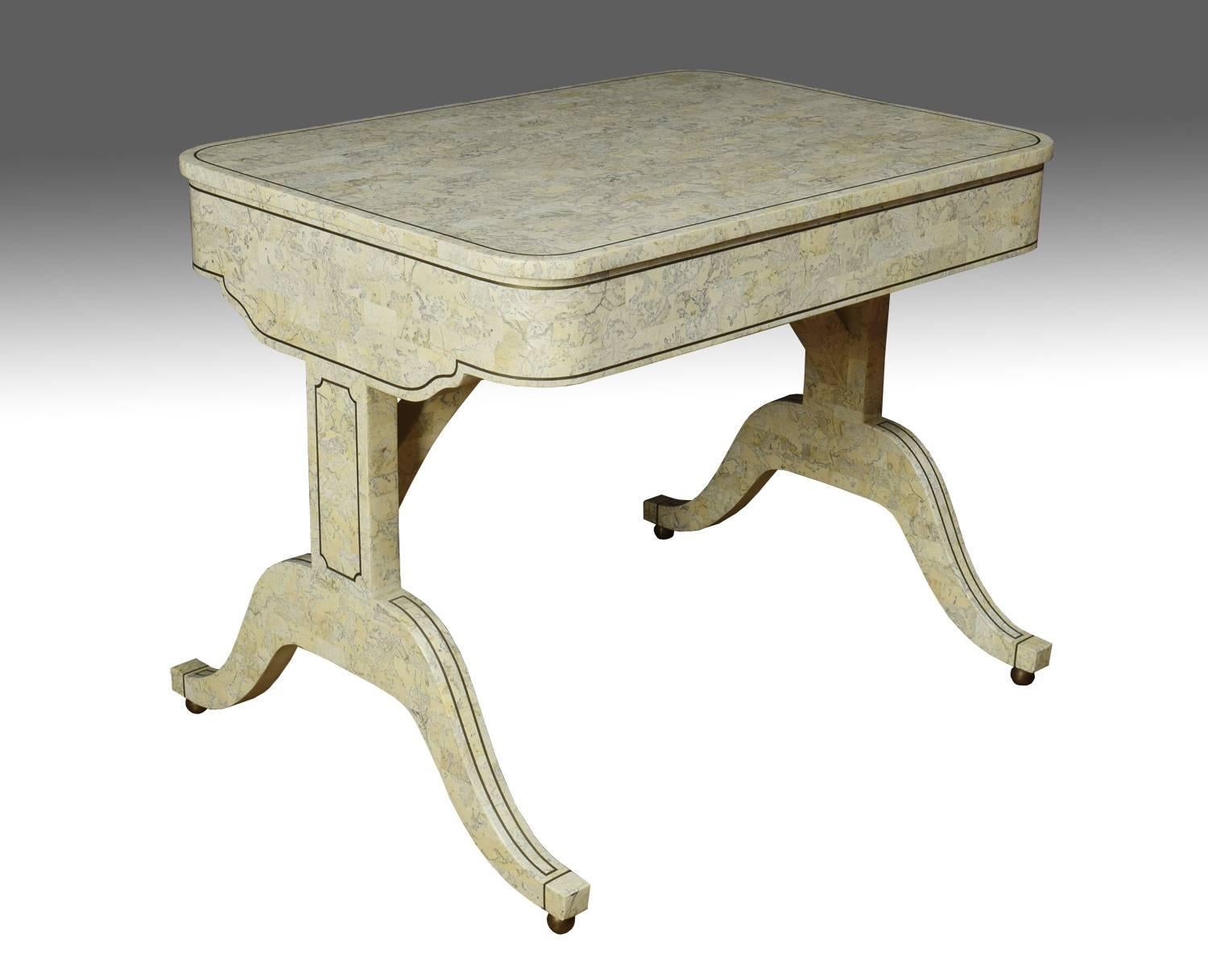 Tesselated stone and brass Regency style sofa table the large rectangular top with rounded corners above two draws standing on splay legs with brass terminals.

Dimensions:
Height 30 inches,
width 37 inches,
depth 26.5 inches.