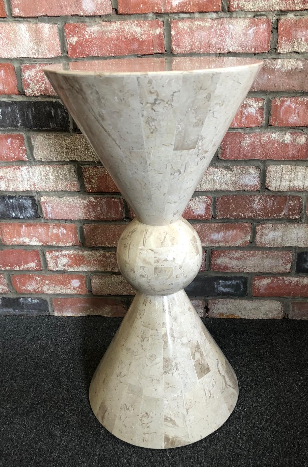 A very nice tesselated stone side table / pedestal by Marquis of Beverly Hills, circa 1990s. There is a small chip on the bottom backside of the table; please see pictures.