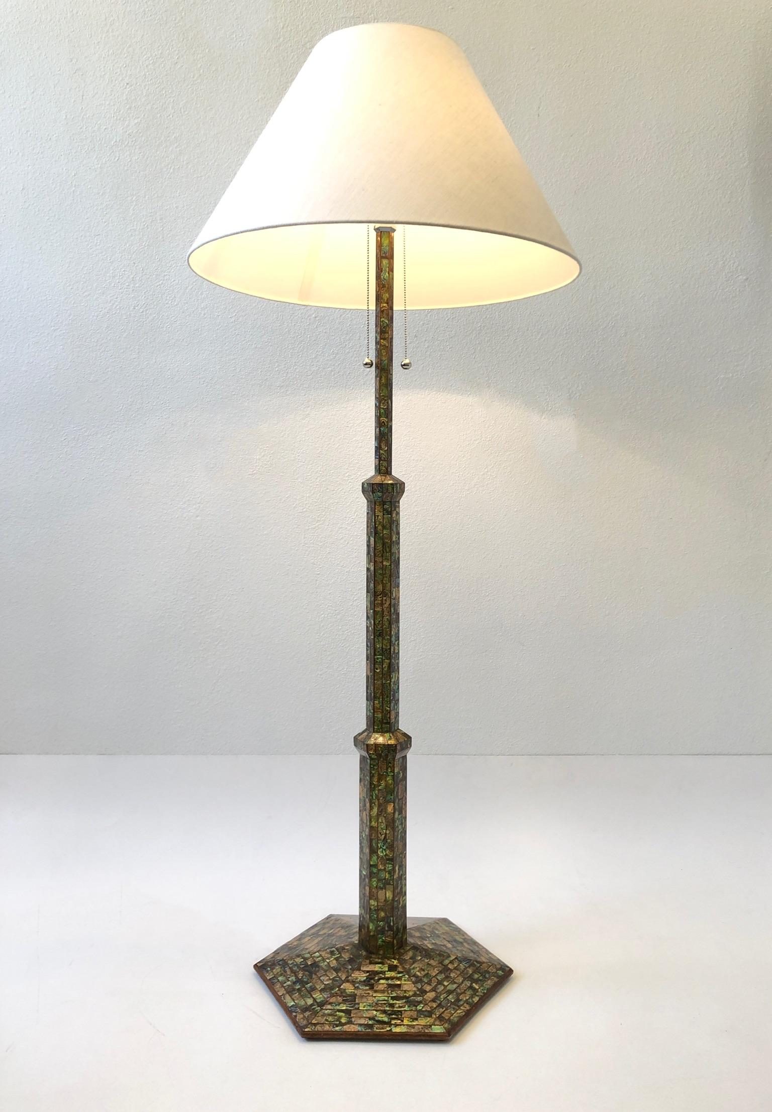 Spectacular 1920’s hexagon shape floor lamp. Constructed of wood that’s tessellated with abalone shell, the hardware is polish chrome. New vanilla linen shade.
Measurements: 26” diameter, 63.5” high, 18.5” diameter Base.