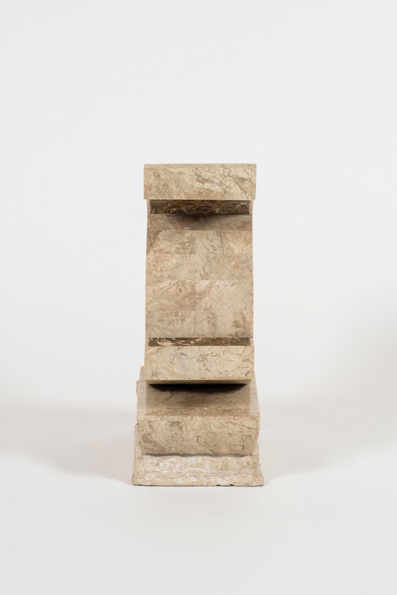 An abstract tessellated two-tone brown marble and travertine sculpture in a deconstructed manner.