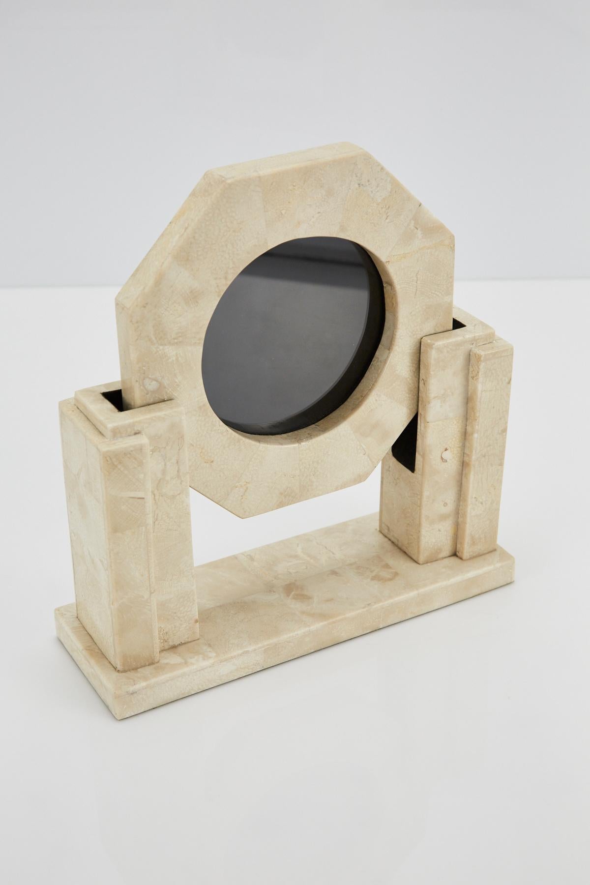 Two-part picture frame consisting of a beige tessellated stone base which holds and elevates the octagonal picture holder. Circular opening for picture measures 5 in. diameter.

All furnishings are made from 100% natural Fossil Stone or Seashell