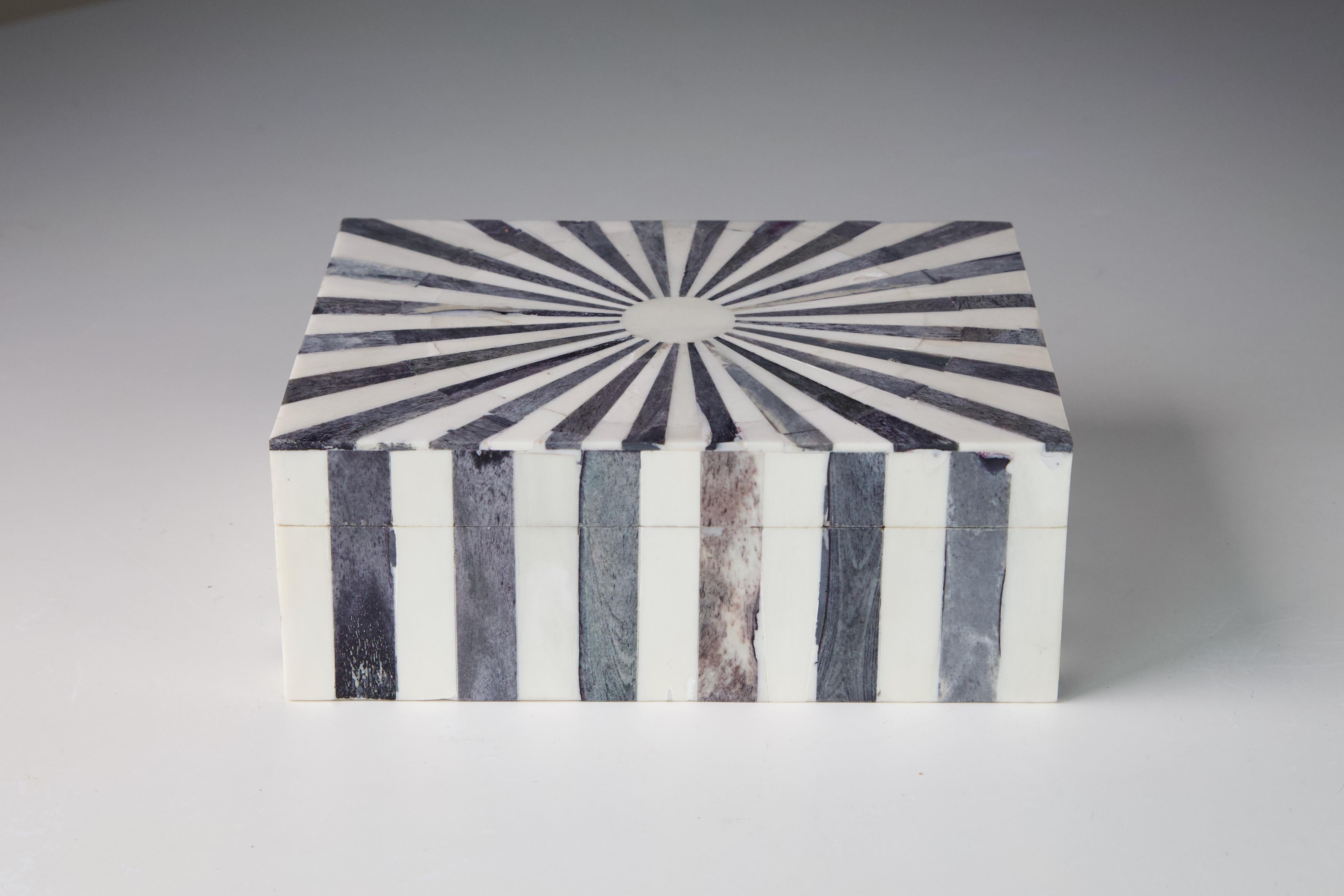 Tessellated bone box with grey and natural bone over wood. A lovely piece that would fit in most decor schemes. 