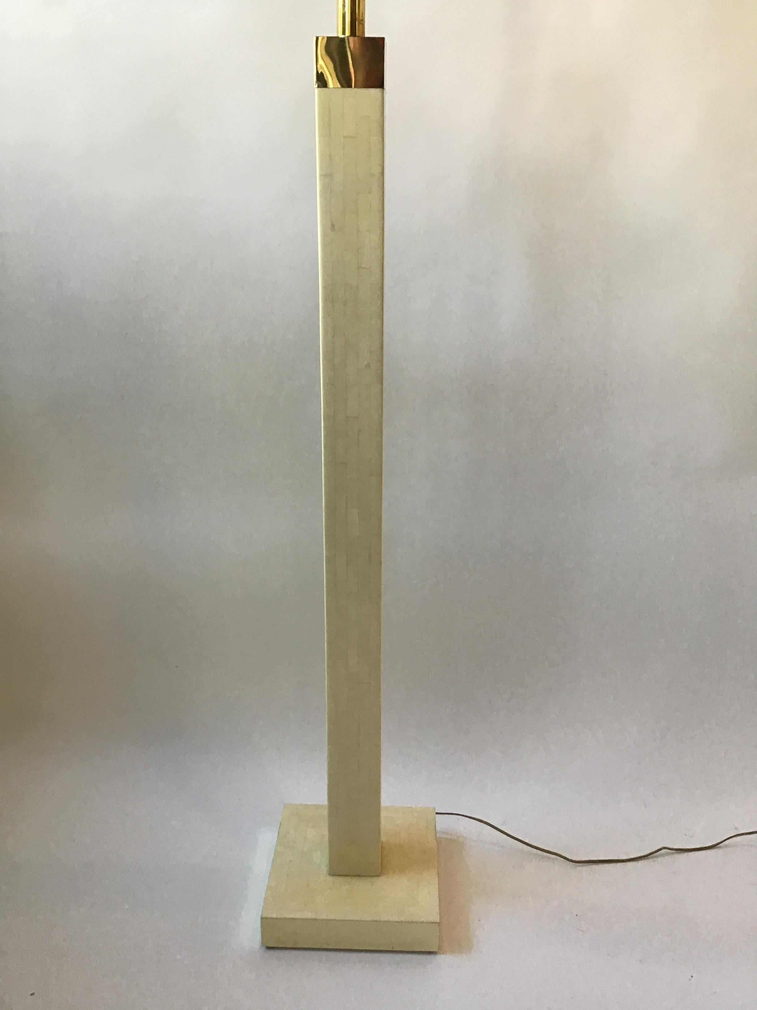 Tessellated bone floor lamp by Jimeco. Made in Columbia. Brass top and base.
  