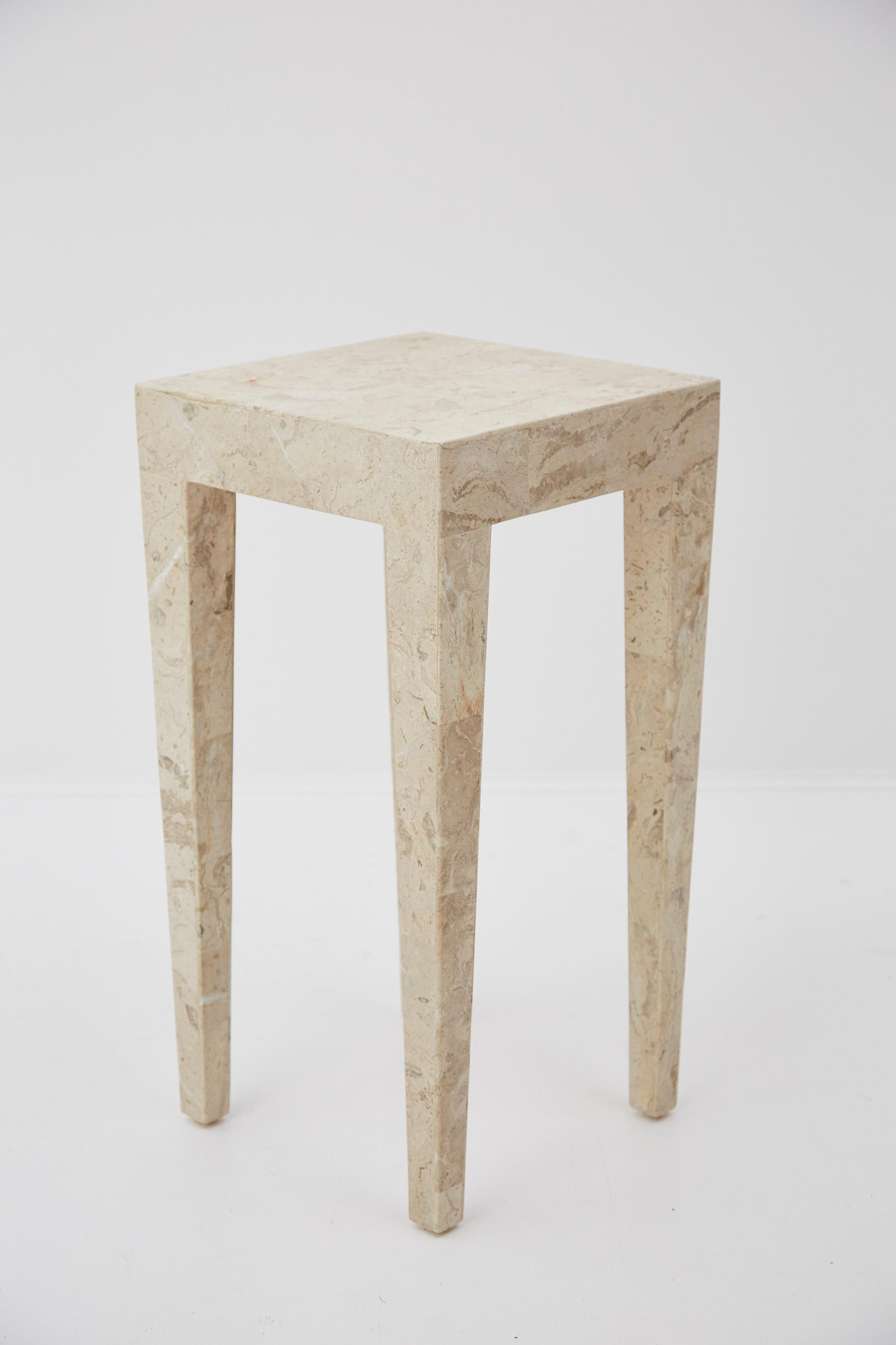 Tall side table comprised of fiberglass body inlaid with tessellated Cantor stone throughout. A simple and modern form to add form and texture to any interior. Measures: 27 inch high.