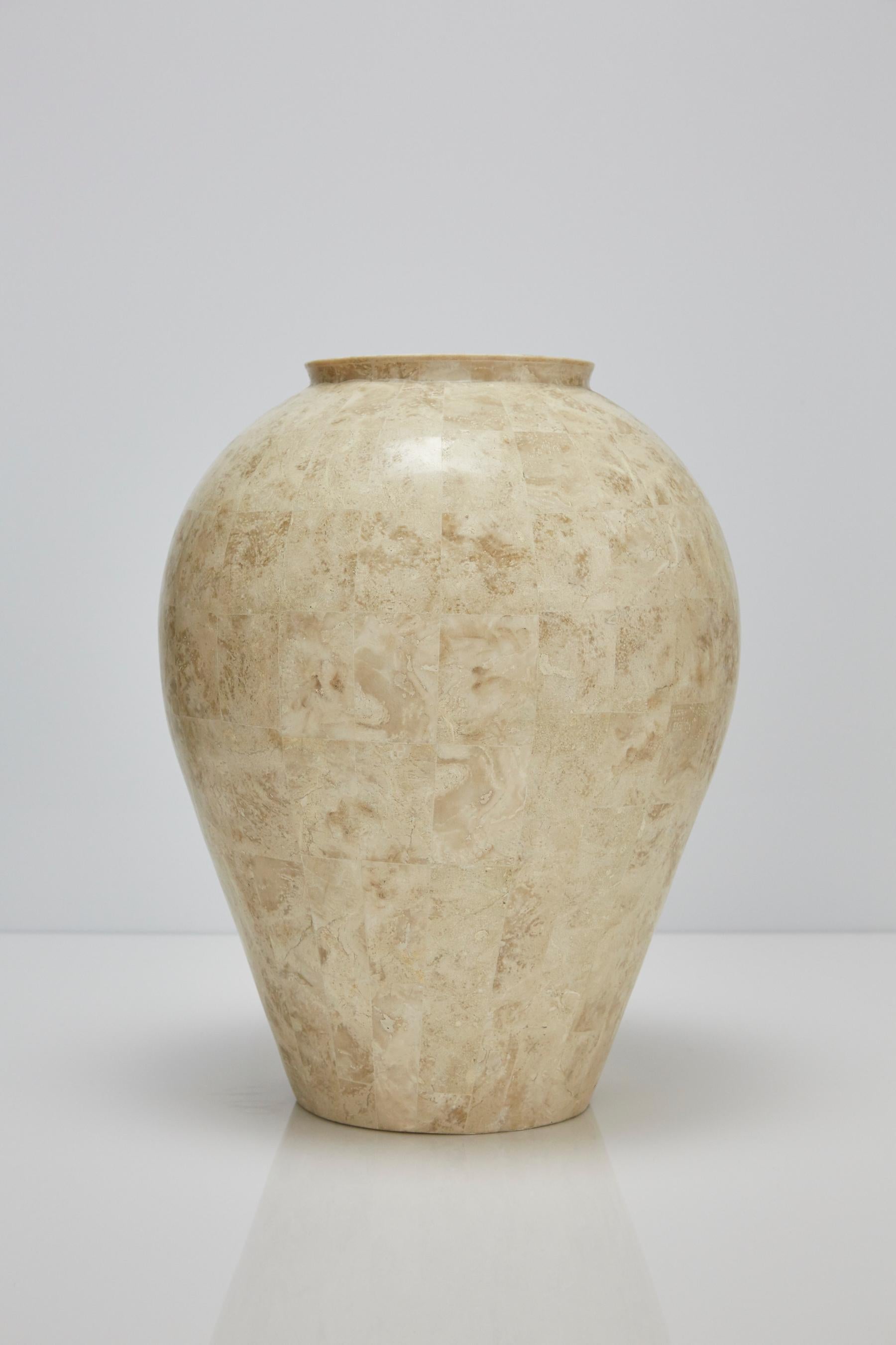 Medium sized floor vase or mango jar covered with tessellated, hand-inlaid cantor stones over a fiberglass body.

All furnishings are made from 100% natural Fossil Stone or Seashell inlay, carefully hand cut and crafted piece-by-piece and precisely