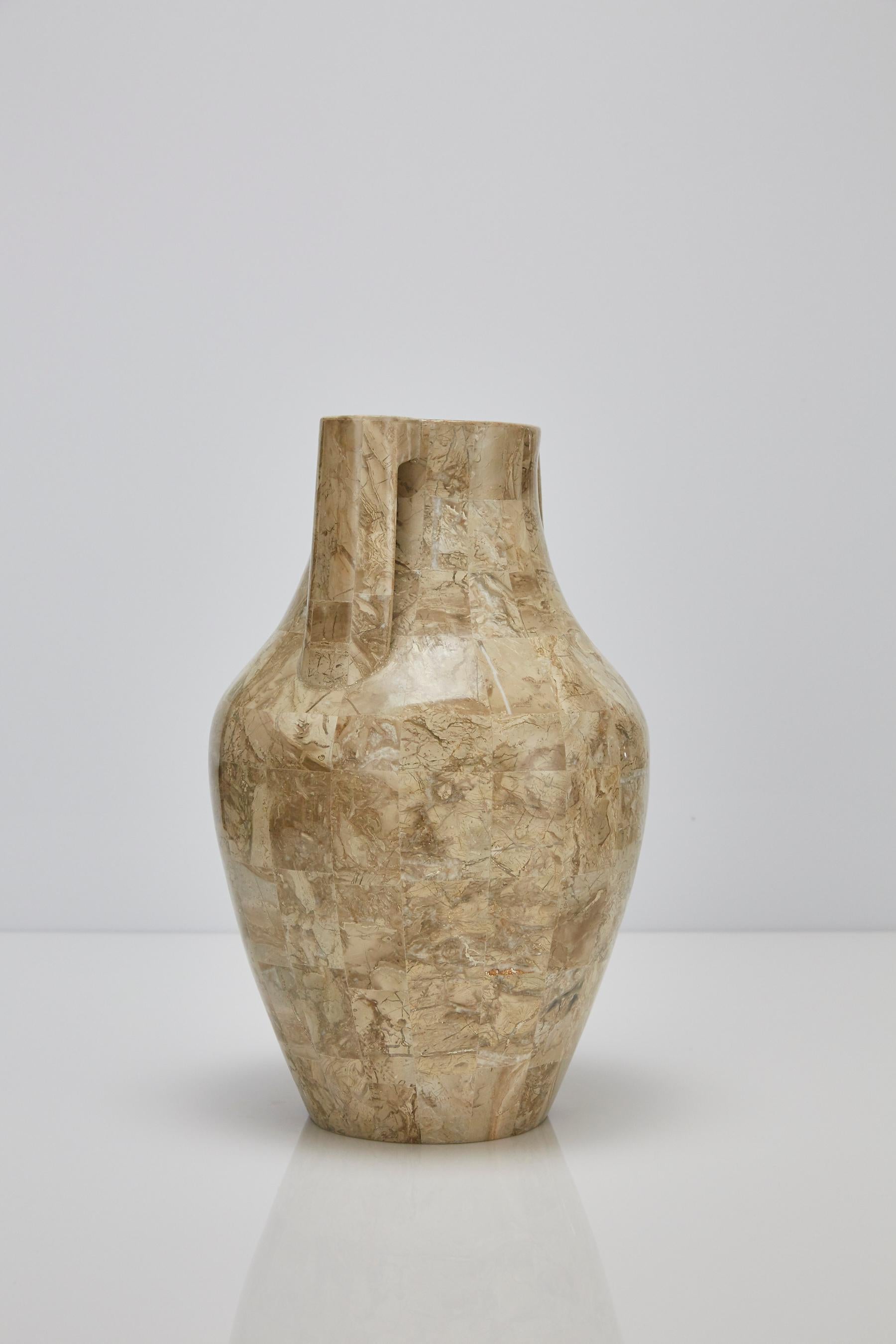 Tall vase styled in the form of a Mesopotamian water jug. Body of vase executed in fiberglass with inlaid cantor stone over the exterior.

Pair available.

All furnishings are made from 100% natural Fossil Stone or Seashell inlay, carefully hand cut
