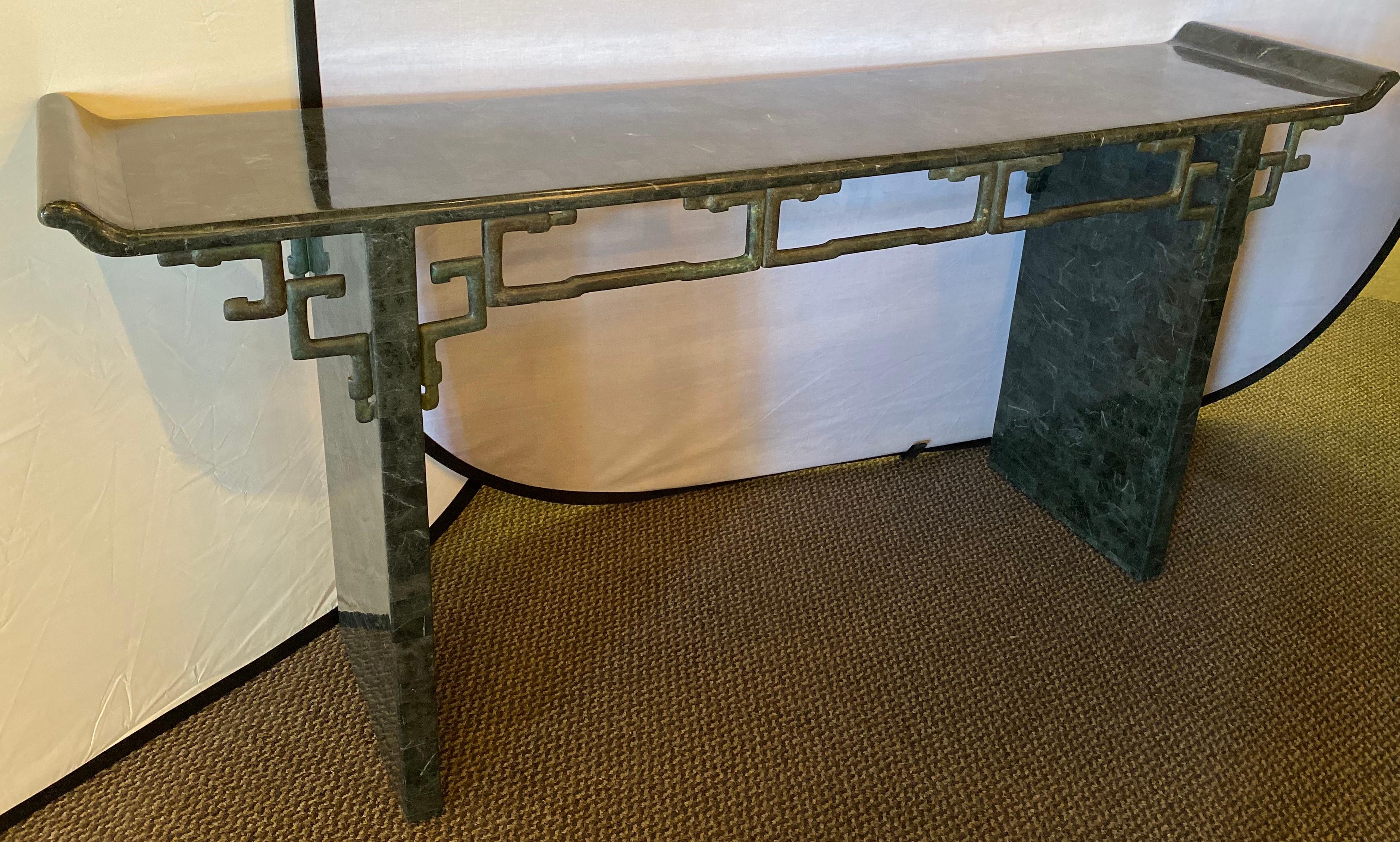 A tessellated Enrique Garcel console or alter table having an Asian flair. This finely decorative console alter table will not disappoint. The Garcel style frame depicts the mixture of Asian influence with Mid-Century Modern design at its peak. The