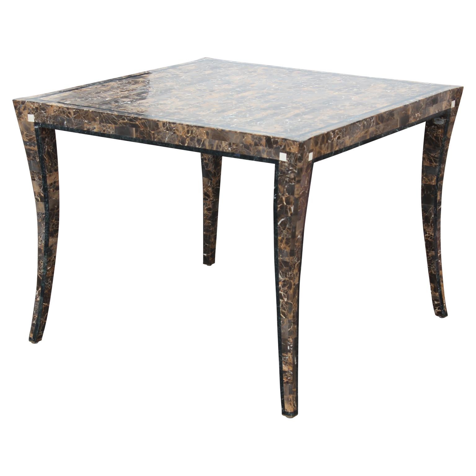 Intricate dark marble inlaid tessellated klismos fossil marble game table made by Maitland-Smith.