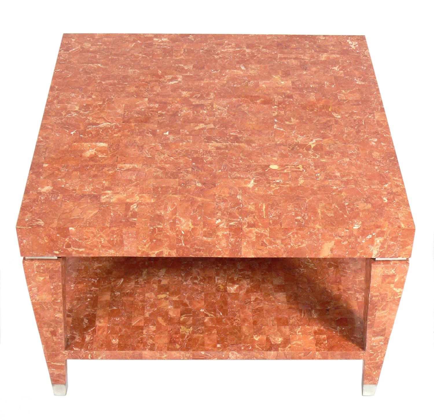 Tessellated marble table, designed by Maitland-Smith, American, circa 1980s. It is a versatile size and can be used as a coffee table, side table, or nightstand. Beautiful coral color tessellated marble with nickel-plated metal details.