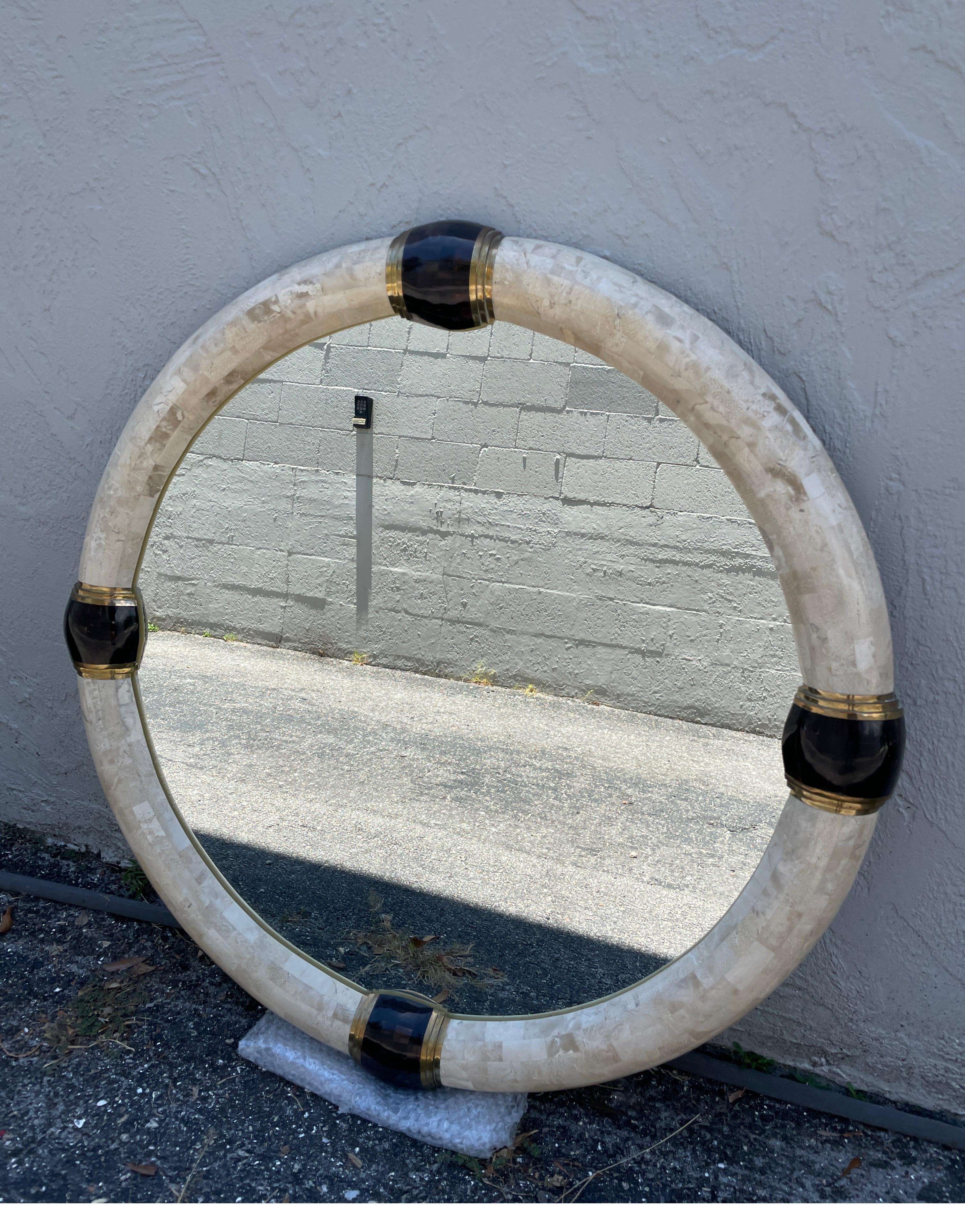 Tessellated marble Karl Springer mirror with pen shell & brass detail on four sides.