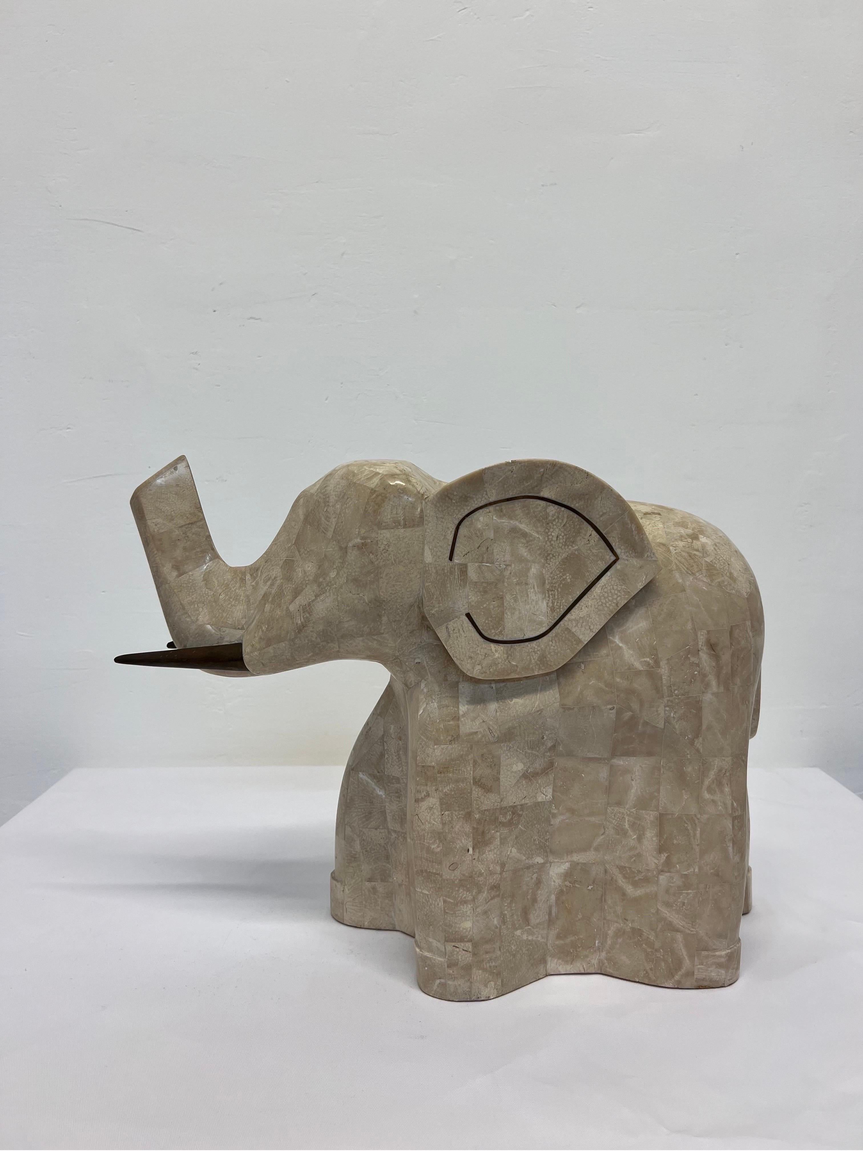 Elephant sculpture made of tessellated marble stone and brass inlay with two patinated brass tusks.