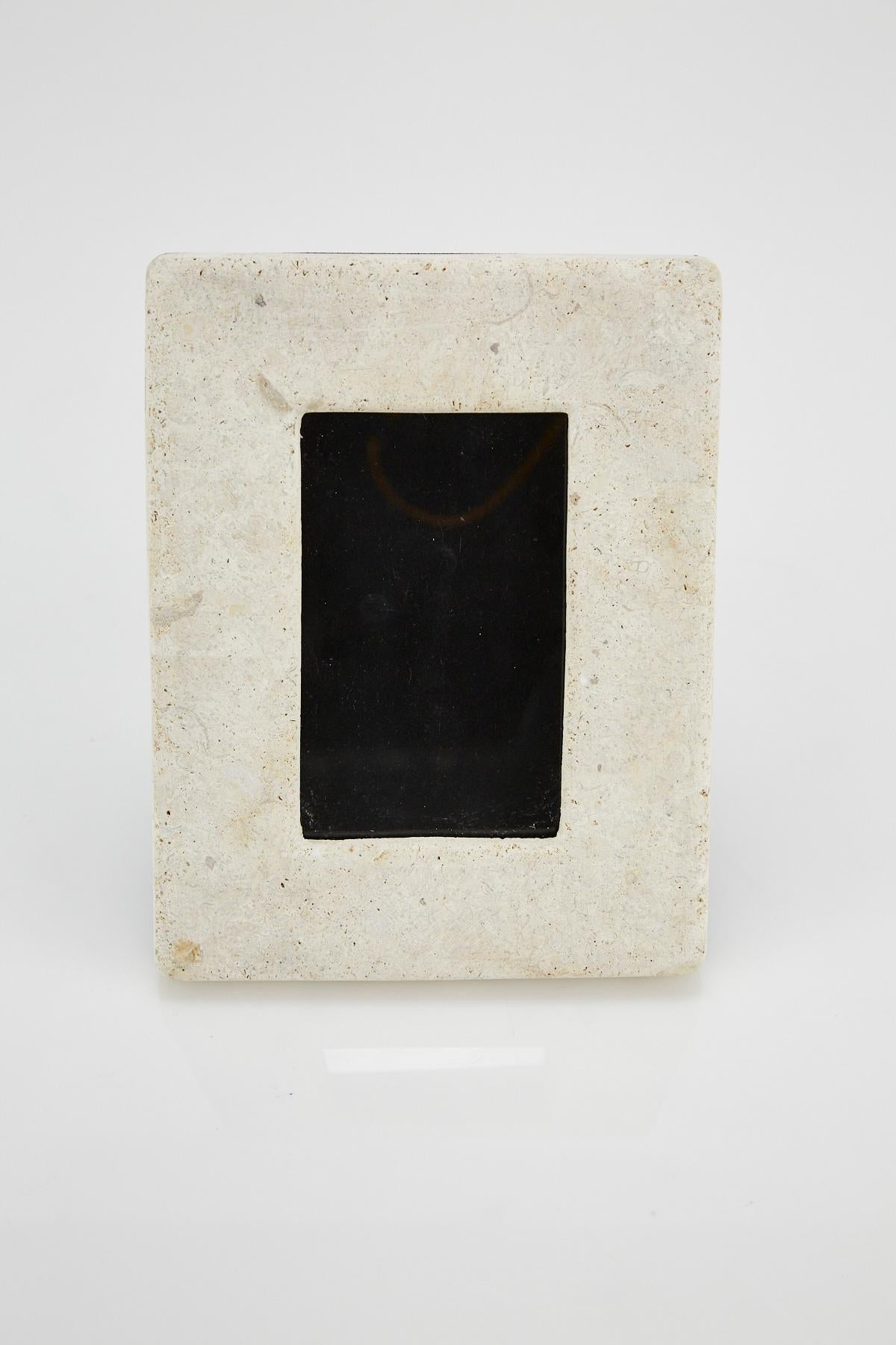 Rectangular 3 x 5 in. picture frame in tessellated matte Mactan stone with black felt back. Opening for picture measures 5 3/8 x 3 1/4 in., frame overall measures 9 x 7 in.

All furnishings are made from 100% natural Fossil Stone or Seashell inlay,