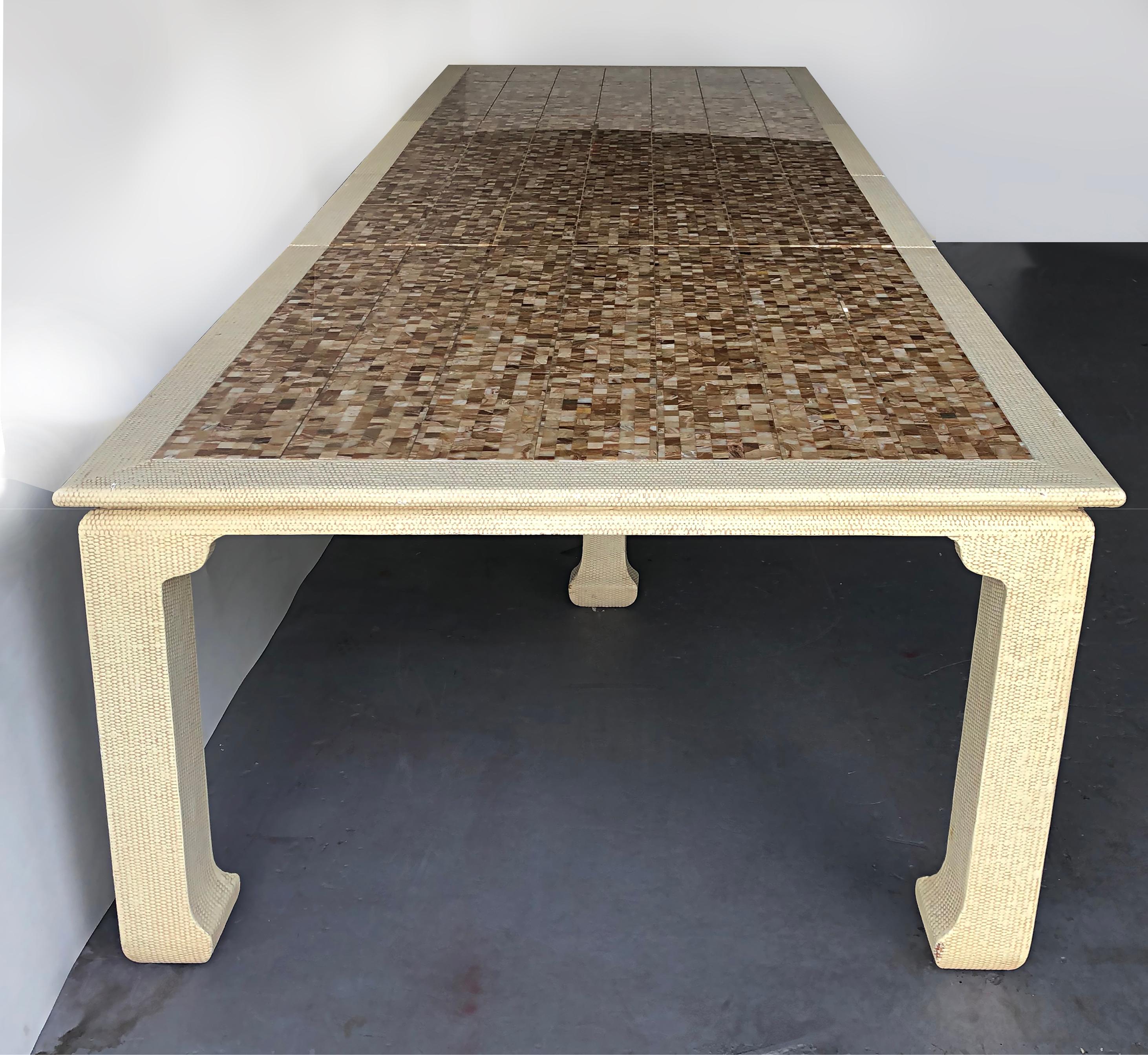 Tessellated Onyx expandable custom dining table, 2 leaves

Offered for sale is a custom-made expandable dining table with an inset tessellated onyx top. The table extends to allow for the addition of 2 leaves. The table has interior legs for