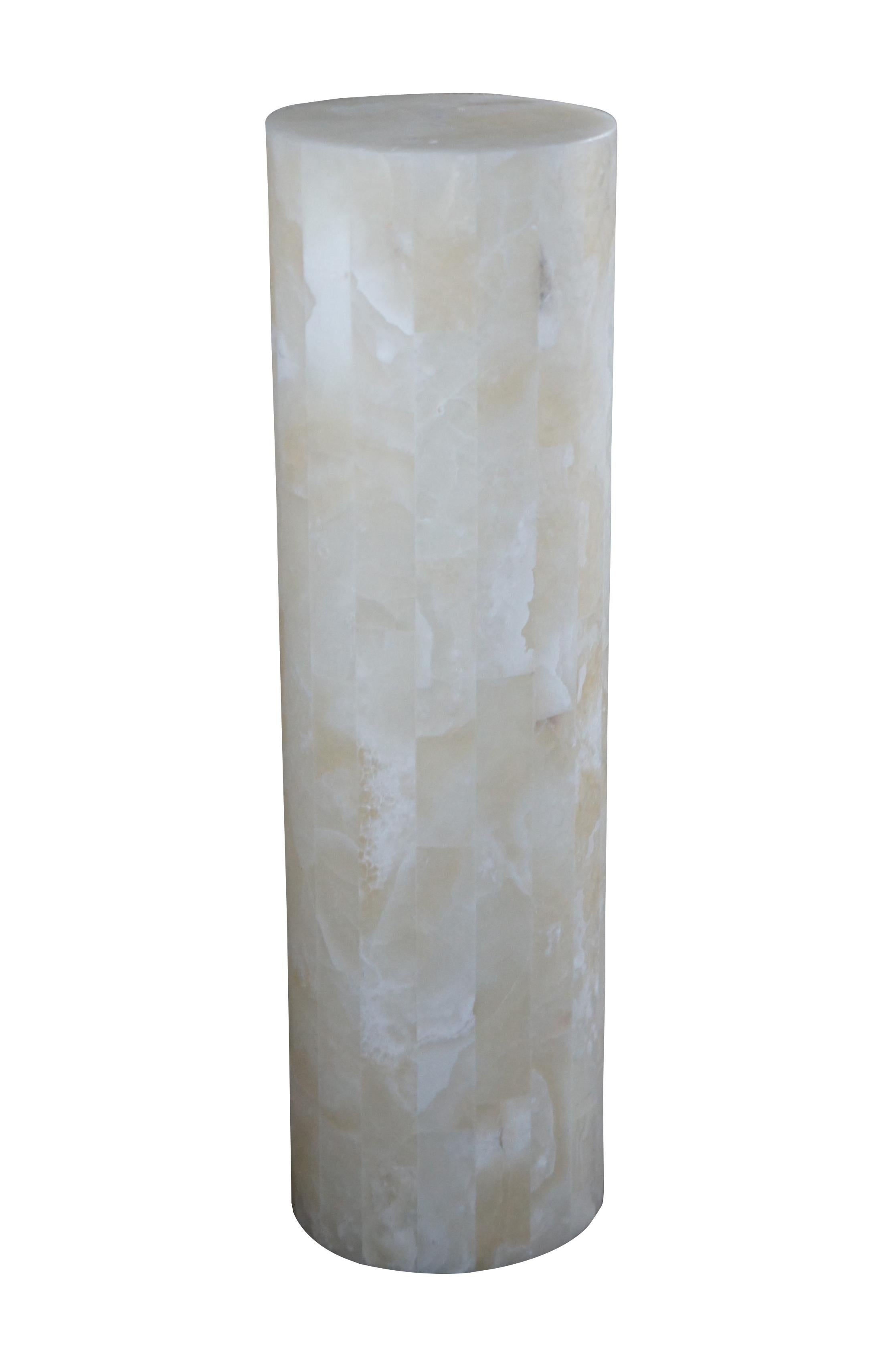 A stunning tessellated onyx illuminated column or floor lamp.  Cylindrical form that is perfect for the display of a sculpture or as a stand alone.  Features two bulbs on the inside that bring about a bright mesmerizing glow.

Dimensions: 
11.5