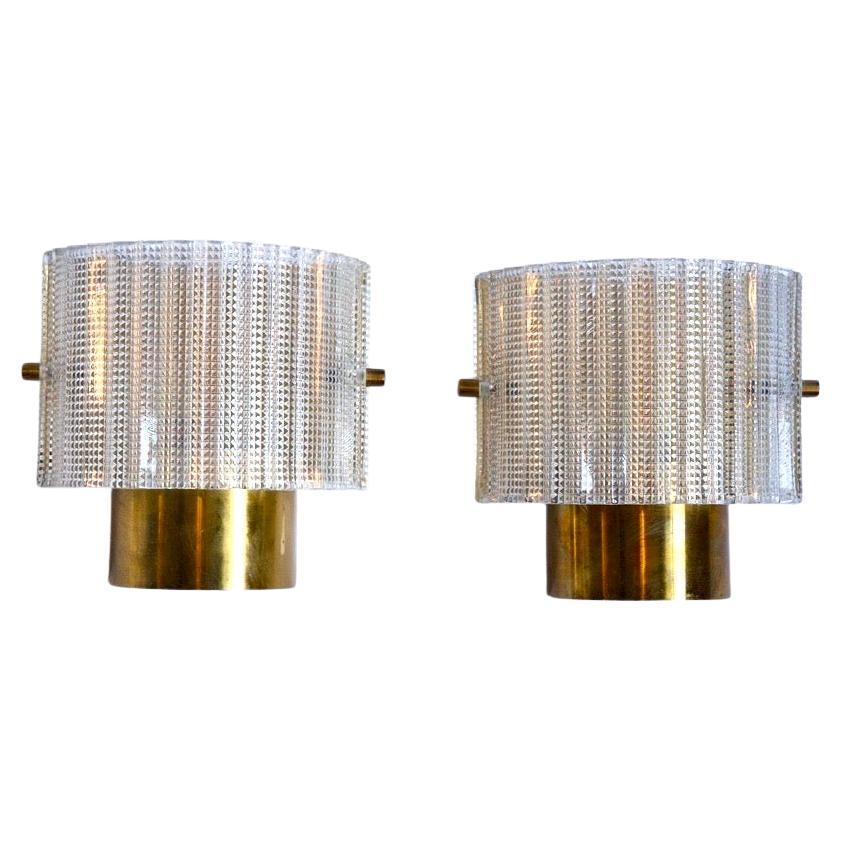 Tessellated Pair of brass and glass Orrefors sconces, Sweden 1970