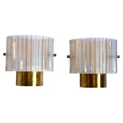 Tessellated Pair of brass and glass Orrefors sconces, Sweden 1970